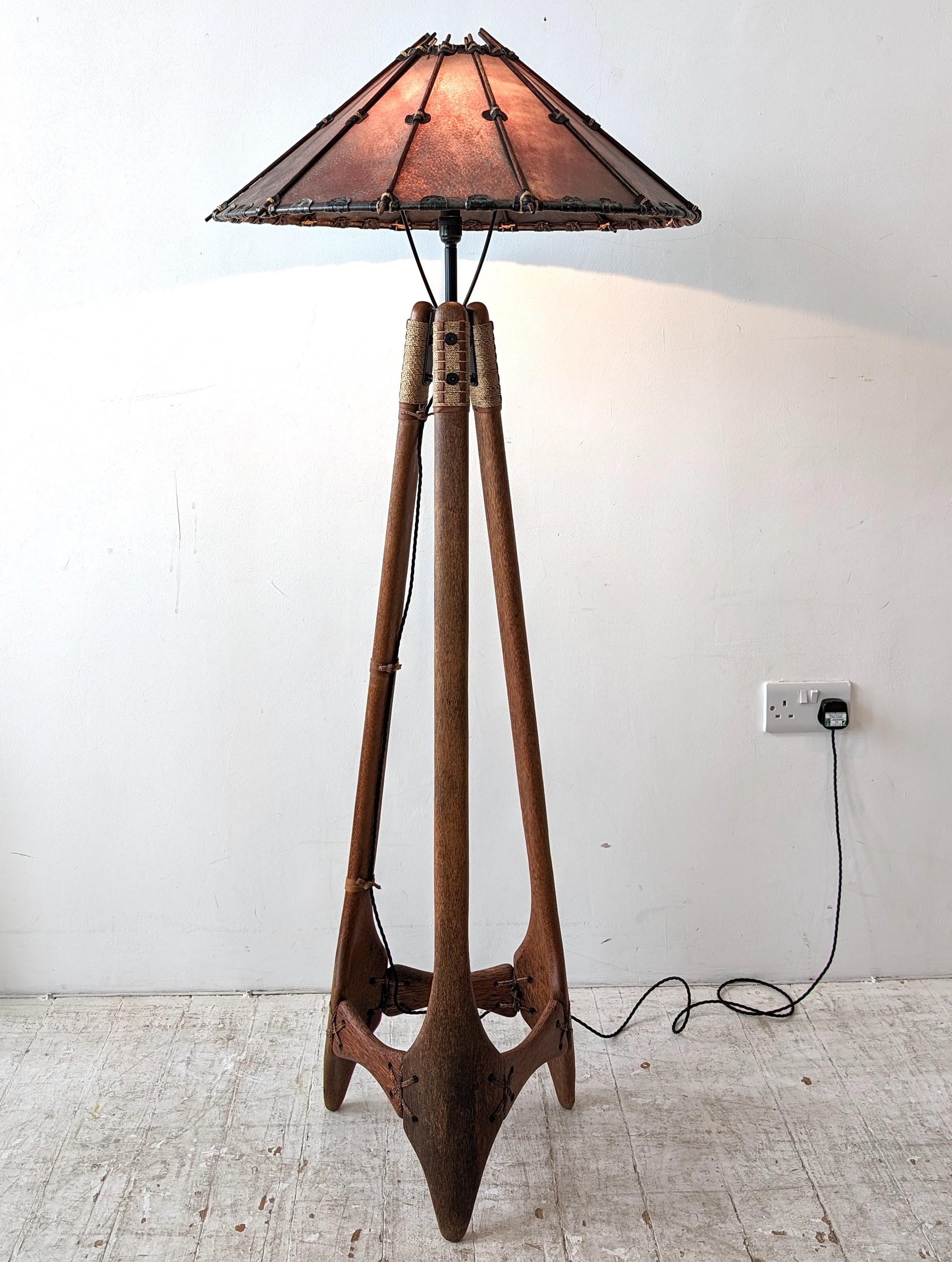 Palmwood, leather and sisal floor lamp, manufactured in Fiji by Pacific Green, c1990s. Waxed leather shade, with sisal and leather details, and black steel fixings.
Newly rewired with braided cord.

Dimensions: height 151cm, diameter of shade 61cm,