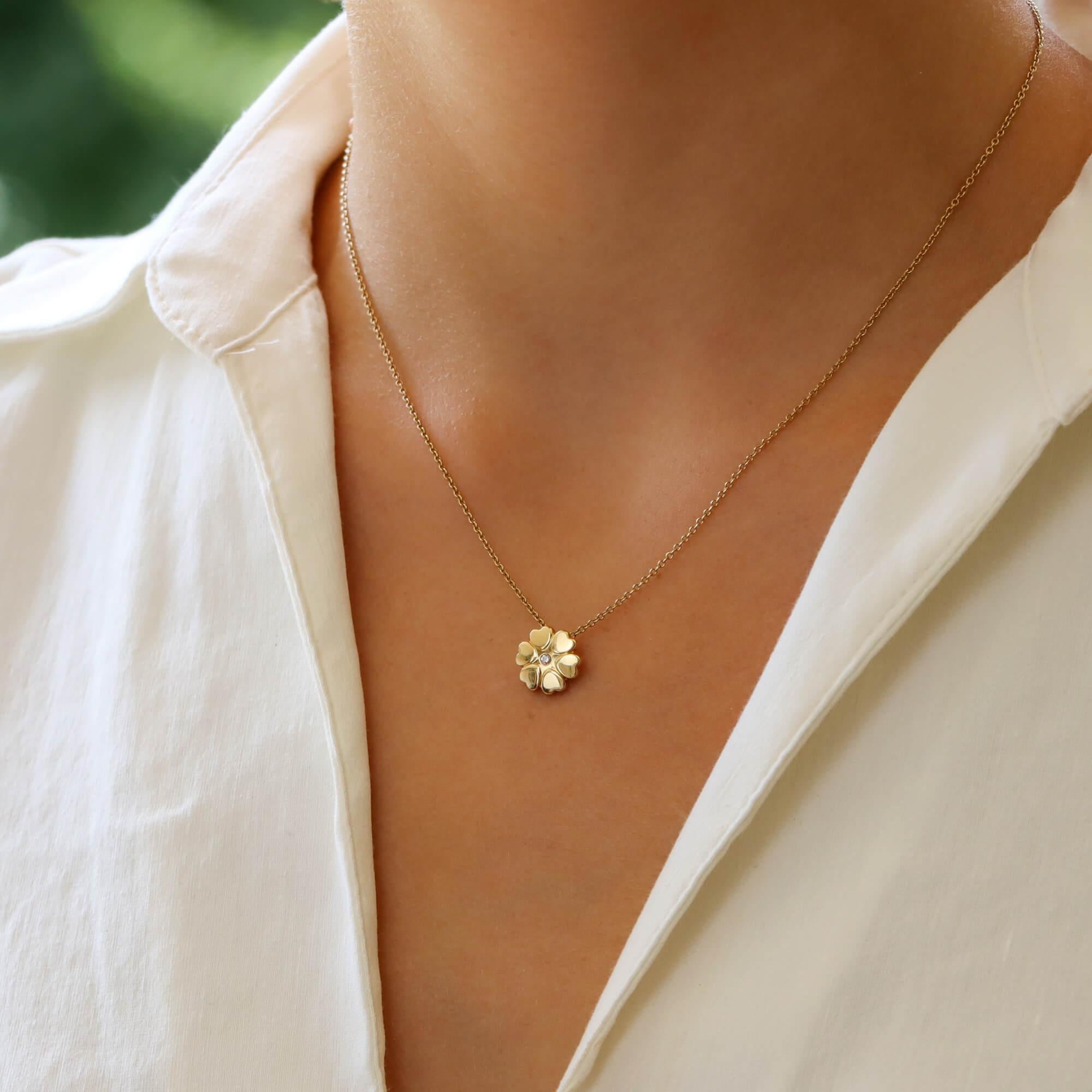 A beautiful Paloma Picasso for Tiffany & Co. pendant necklace set in 18k yellow gold.

From the now discontinued ‘Crown of Hearts’ collection, the pendant is centrally set with a sparkly round brilliant cut diamond surrounded by a halo of yellow