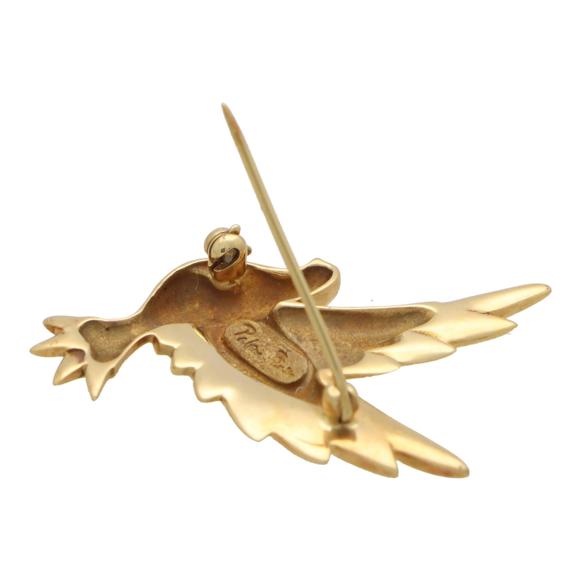A beautiful vintage Paloma Picasso for Tiffany & Co. dove brooch set in 18k yellow gold.

The brooch is composed of a flying dove motif, made of polished 18k yellow gold. It is secured to reverse with a long pin roller clasp fitting.

Due to the