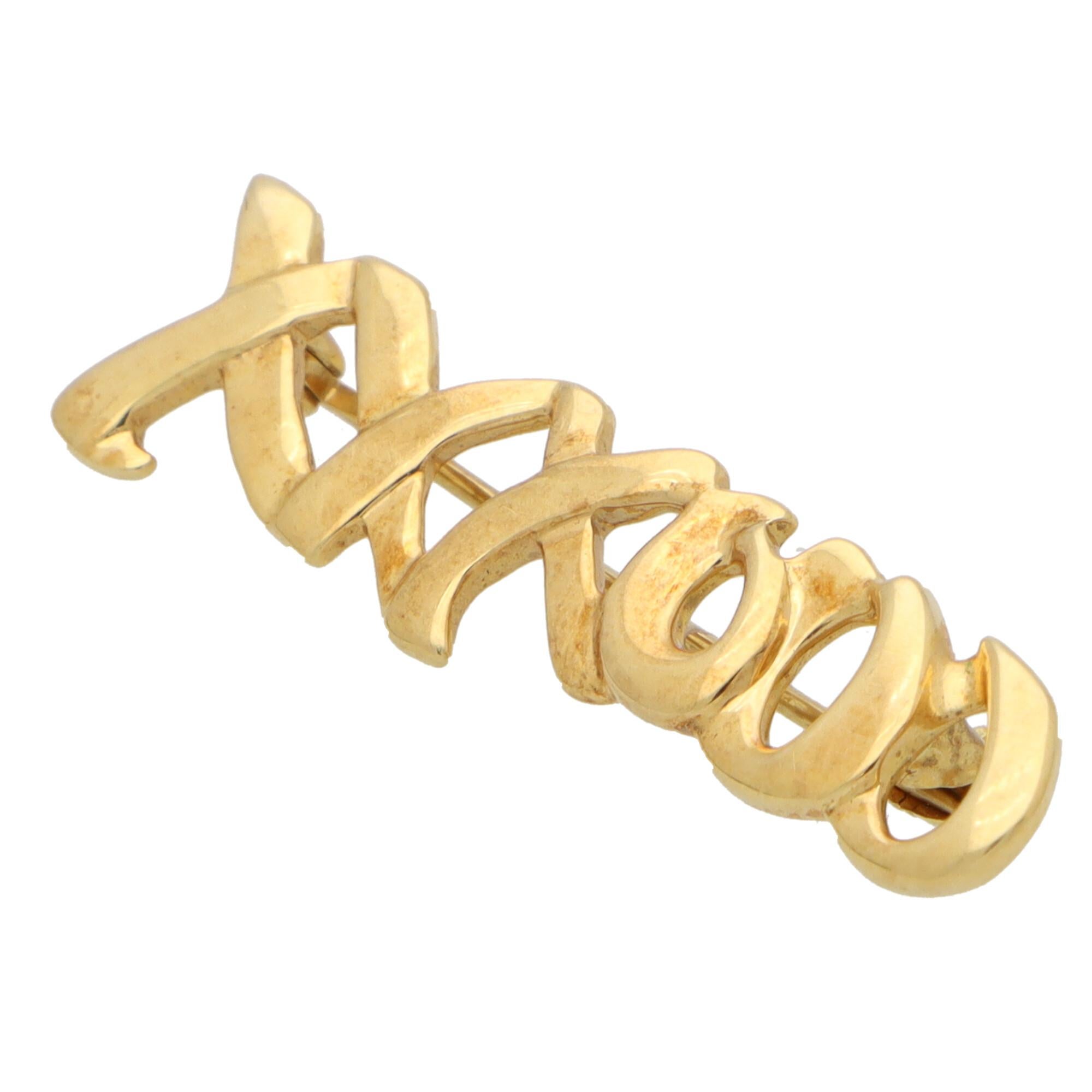 A beautiful vintage Paloma Picasso for Tiffany & Co. 'Love and Kisses' brooch set in solid 18k yellow gold.

The brooch is simply set with a 'XXXOOO' motif to symbolise the common anagram for love and kisses. It is secured to reverse with a long pin