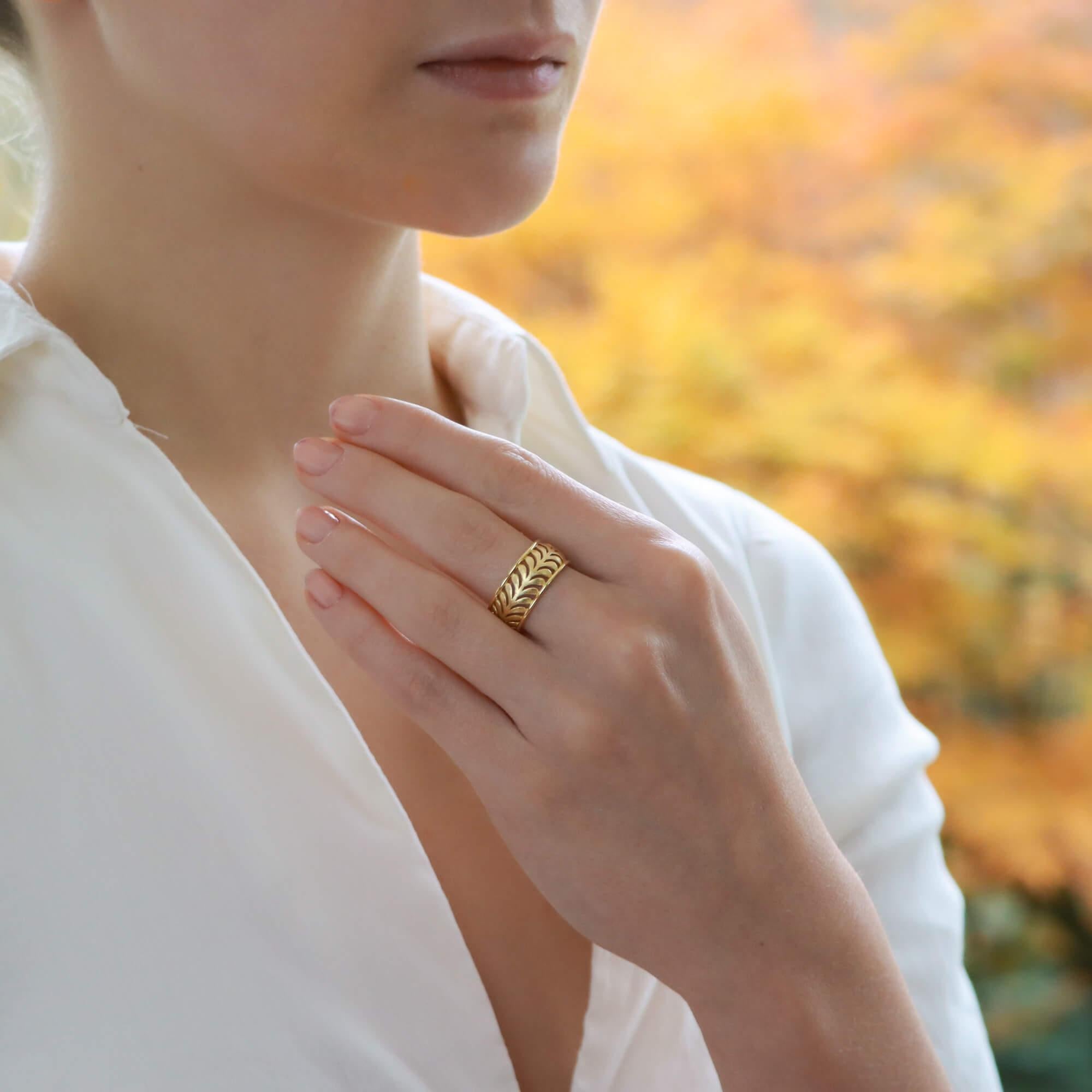 A beautiful vintage Paloma Picasso for Tiffany & Co. 'Villa Palm' band ring set in 18k yellow gold. 

The piece is composed of a band design with openwork palm leaf motifs travelling throughout the band.  Due to the size and design this piece would