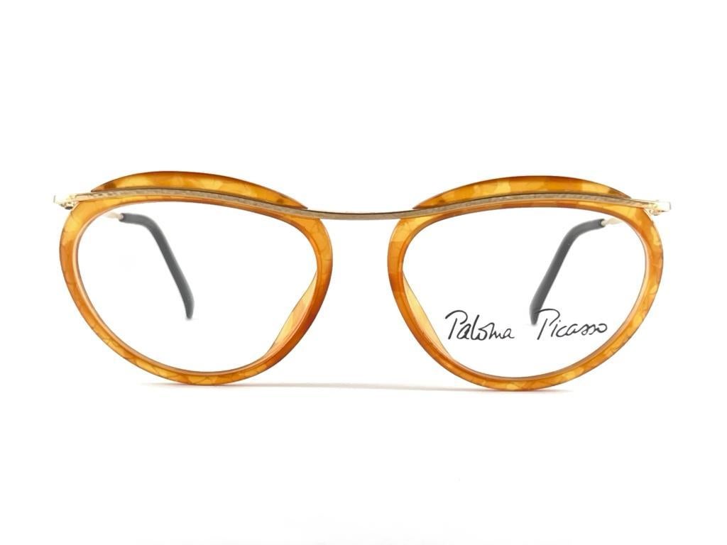 
 Amazing Pair Of Vintage Paloma Picasso Design Tangerine & Gold Frame Ready For Your Prescription Or Tinted Lenses 
 New, Never Worn Or Displayed


Made In Germany



Front                                 13.5 Cms
Lens Height                      