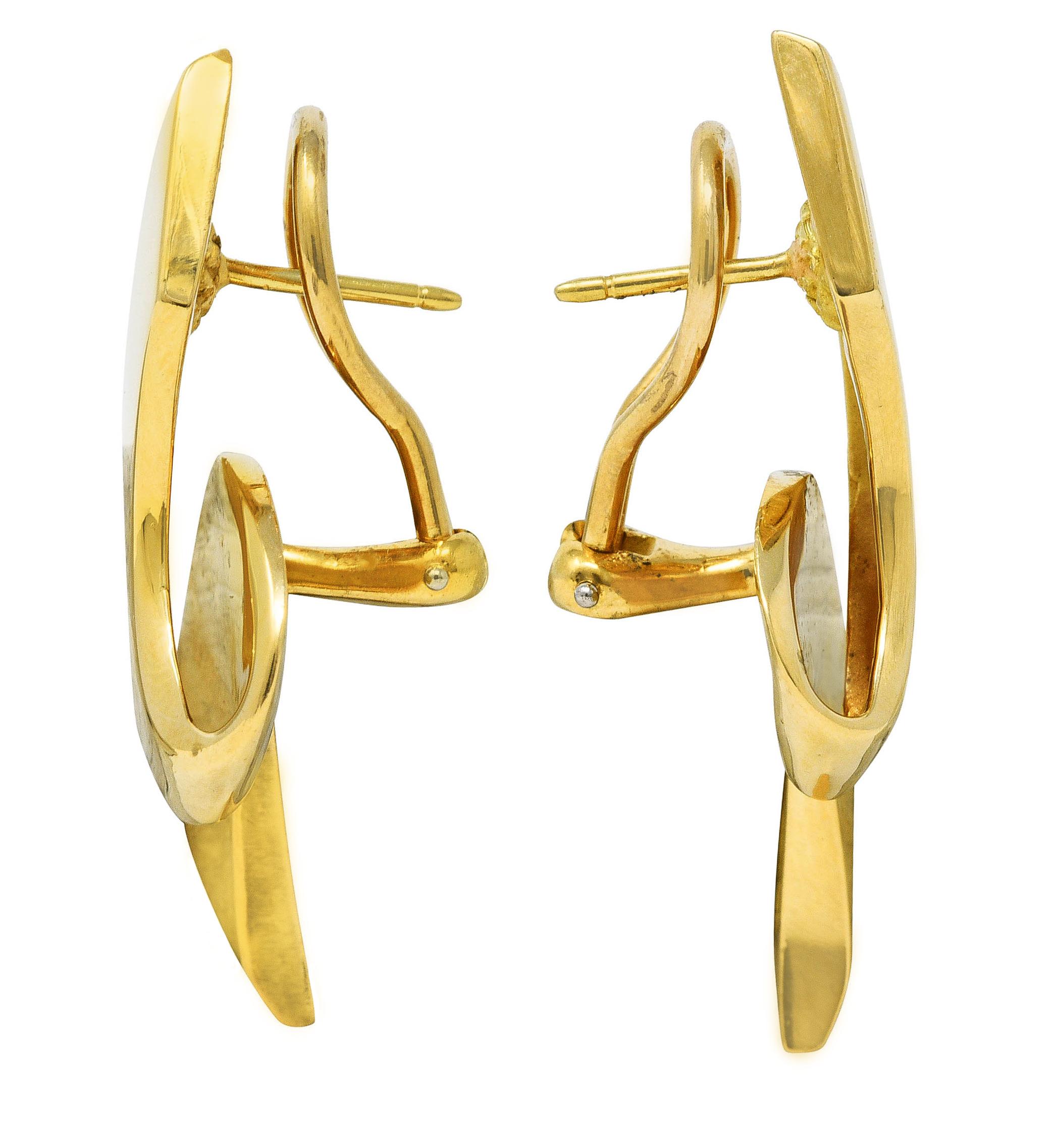Earrings are designed as looping ribbon motif

With high polished gold finish

Completed by posts with hinged omega backs

Tested as 18 karat gold

Fully signed Paloma Picasso Tiffany & Co.

Circa: Stamped 1985 from the Ribbon collection

Measures: