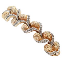Pulsera trenzada de oro Panetta vintage con piedras de pavé transparentes Circa 1960s