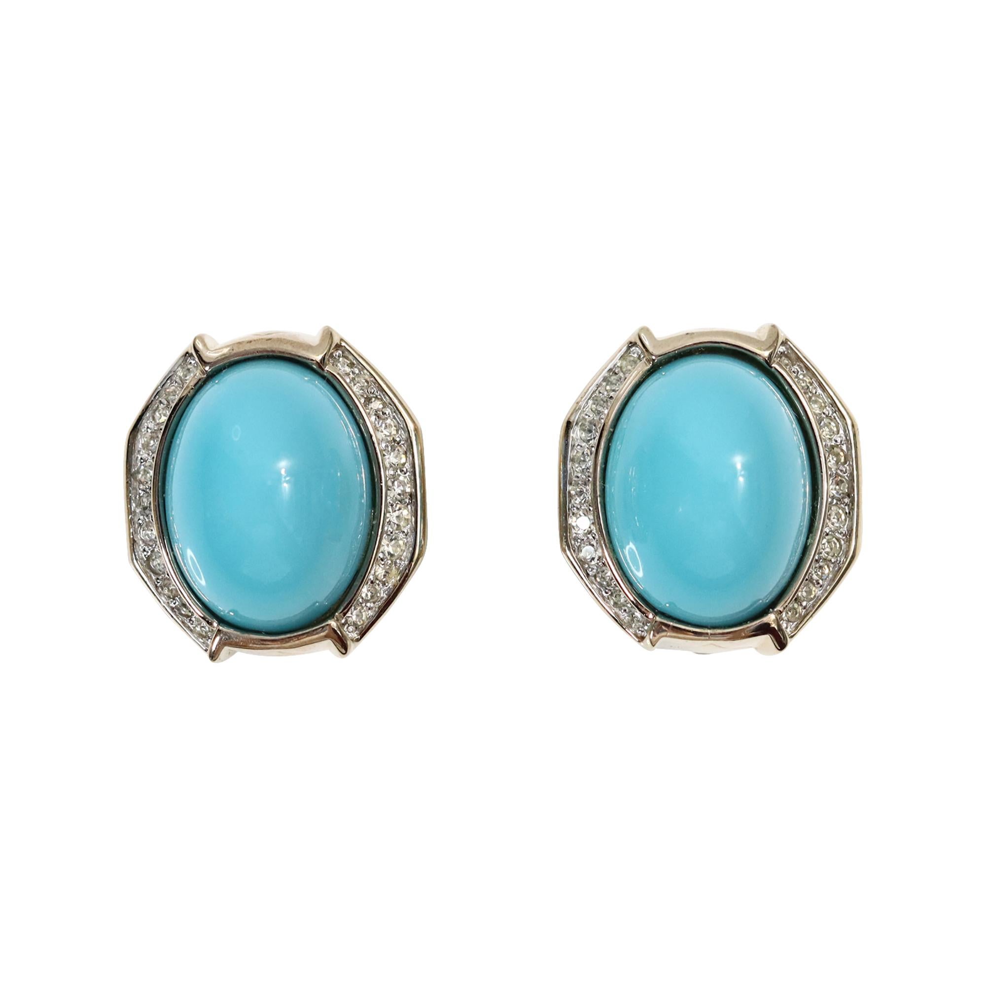Vintage Panetta Gold Tone Diamante Faux Turquoise Earrings Circa 1980s.   They are shown in gold metal with diamante and faux turquoise.  Always in style for lunch, dinner, or evening wear. Clip on.
The metal appears silver in the photos, but it has