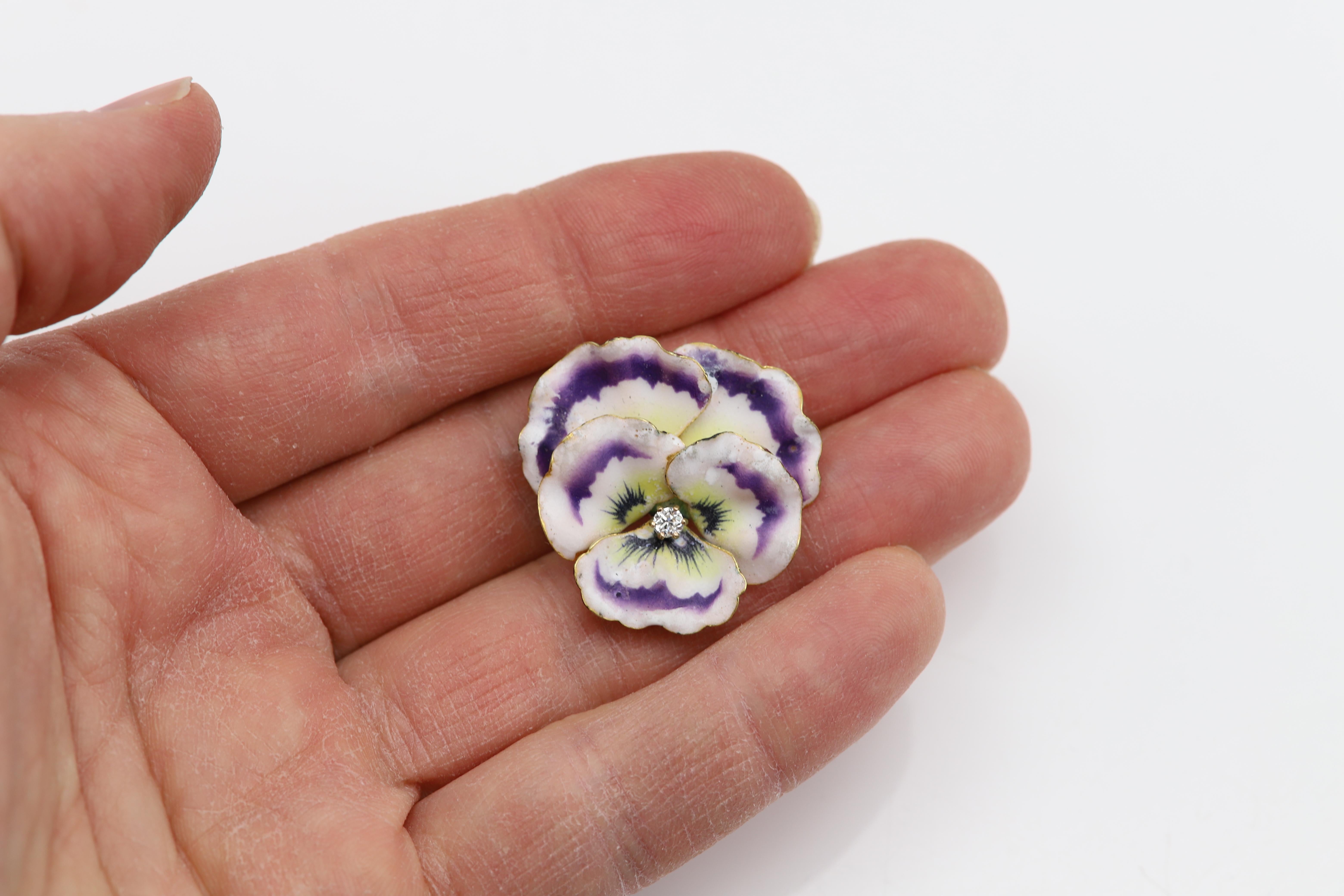 Vintage Pansy Art Nouveau Brooch
Enamel and a center Diamond.
very beautiful piece.
From the late 1800's

Weight is: 9.60 grams
Size is: approx 1.25' inch
Diamond is 3mm approx 0.12 carat G-VS
Color: Brilliant Purple , white  and Yellow
Condition: 