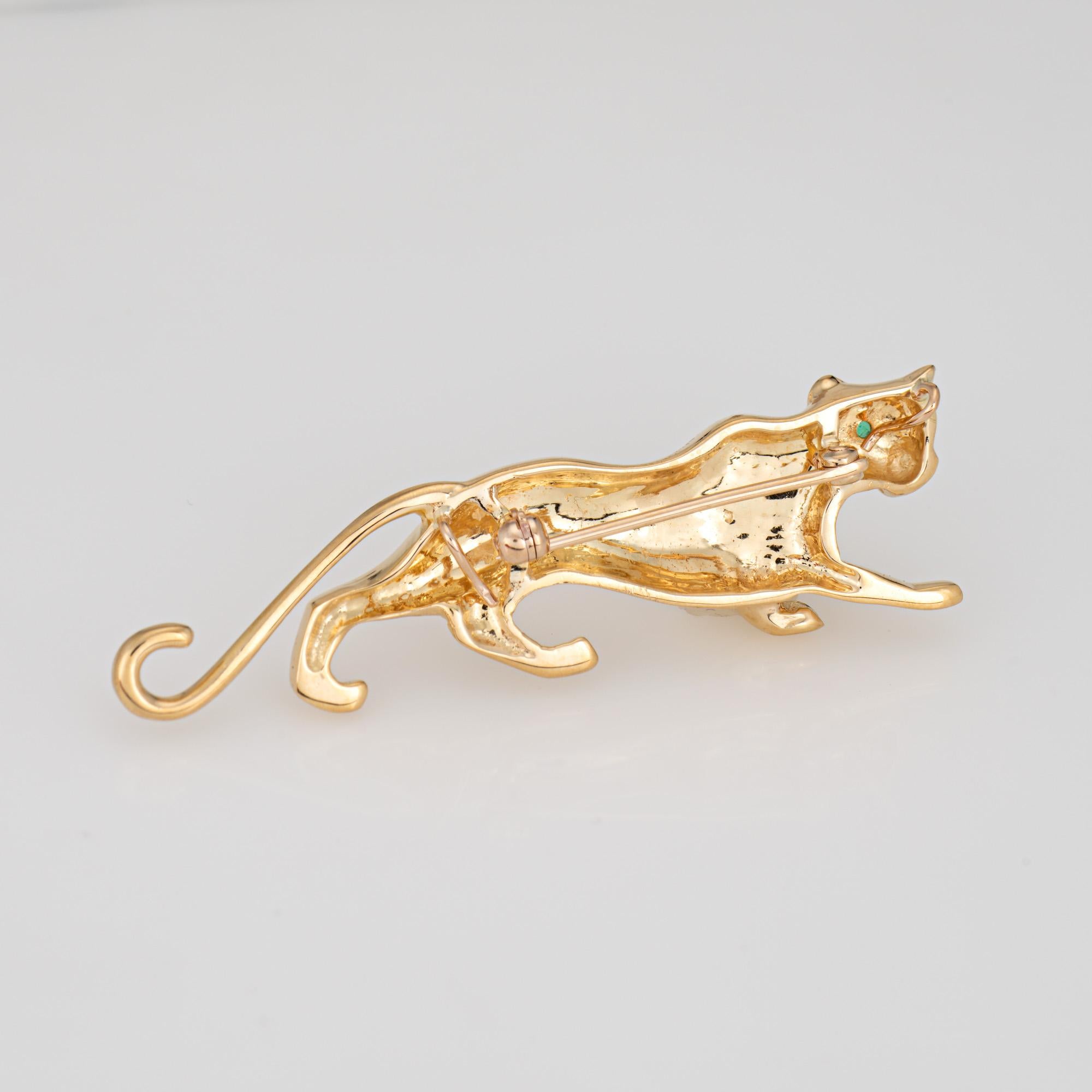 Unique & stylish vintage panther pendant/brooch crafted in 18 karat yellow gold (circa 1980s to 1990s). 

One small estimated 0.01 carat emerald is set into the eye.   

The beautifully designed piece brings to life the majestic panther. The dragon