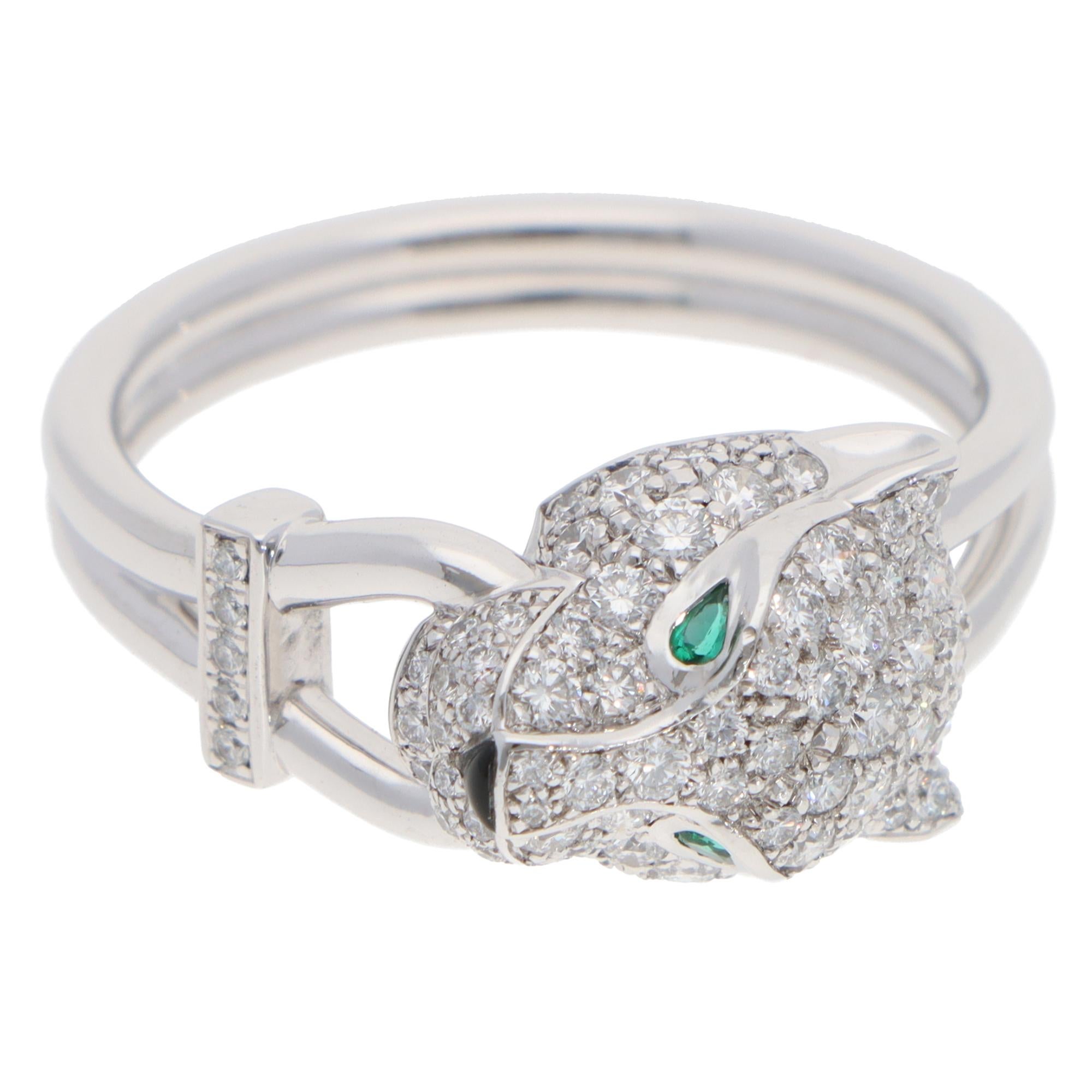 A beautiful vintage Panthère de Cartier diamond ring set in 18k white gold with emerald and onyx.

From Cartier's sought-after collection, this piece features Cartier's iconic panther head motif, crafted from solid 18k white gold. The panther is