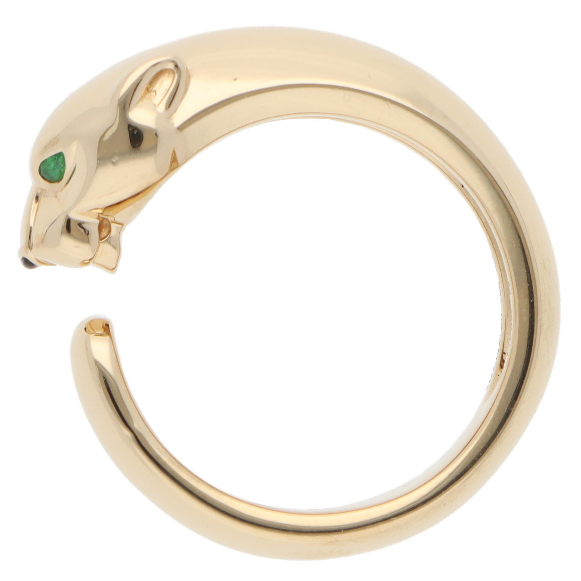 A beautiful vintage Cartier 'Panthère de Cartier' ring set in 18k yellow gold.

From Cartier's sought-after collection, this piece features Cartier's iconic panther motif, crafted from solid 18k yellow gold. The panther is adorned with two faceted