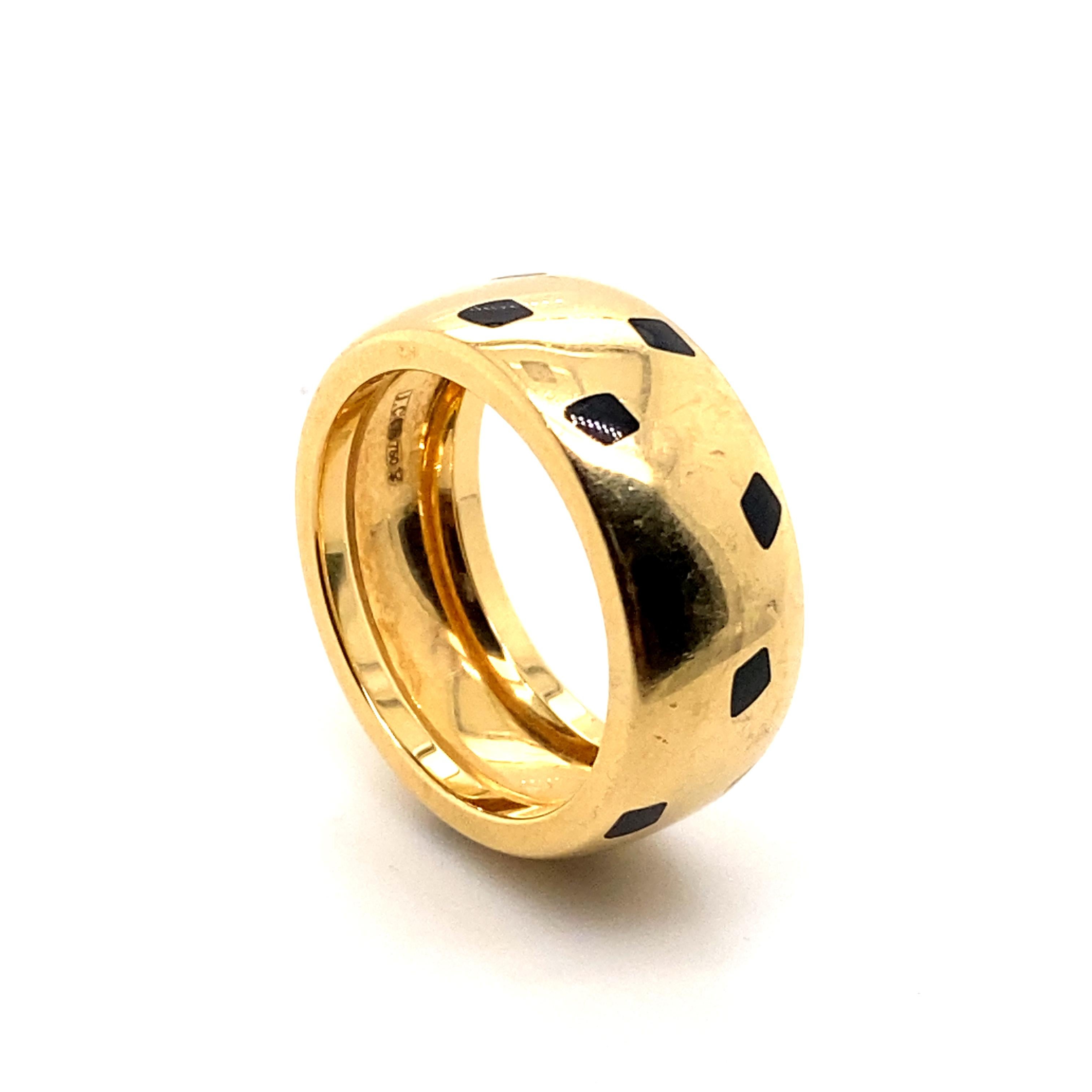 A vintage Panthère de Cartier ring with black lacquer in 18 karat yellow gold, circa 1990

The wide 18 karat yellow gold band is accented throughout with black lacquer leopard spots

The Cartier Panthère design is still looking iconic after 100