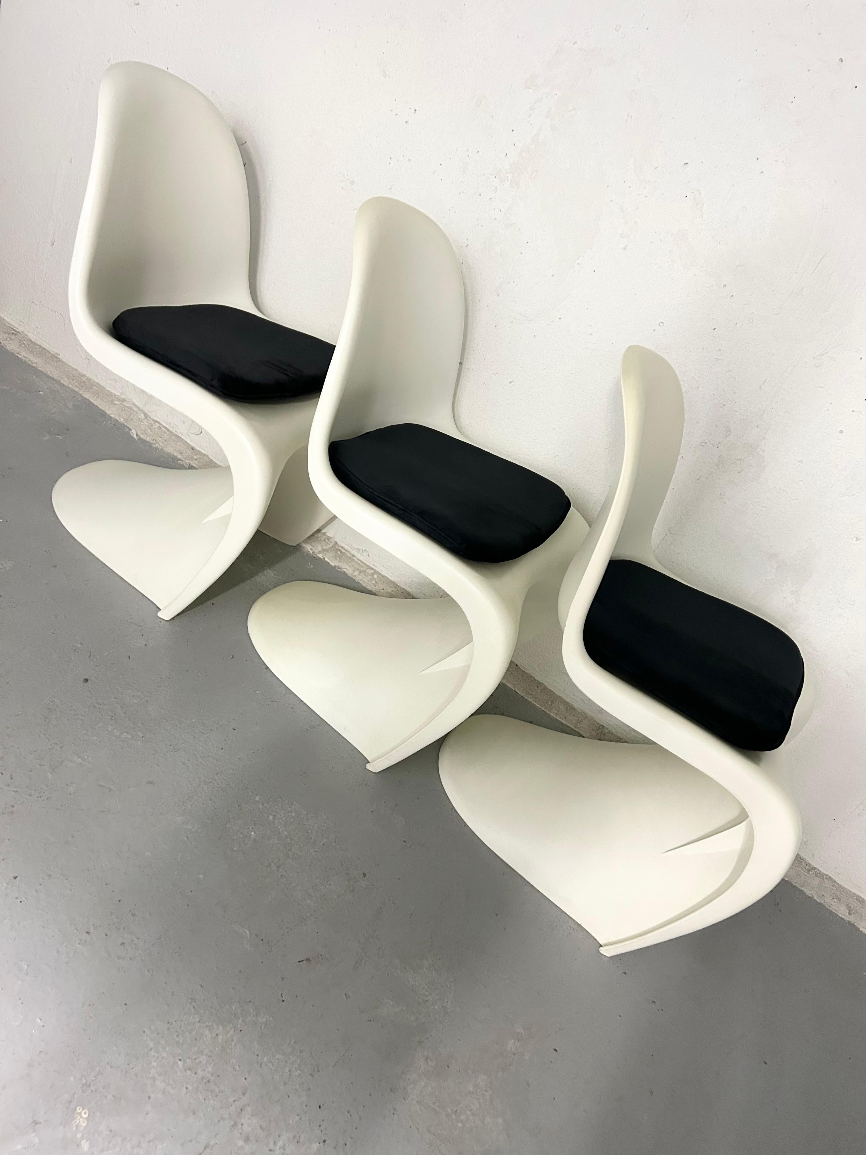3 available - vintage Vernor Panton style chairs - reproductions from the 70s. No manufacturer markings. Minimal wear - one chair has small marks on one edge. Seat cushions were purchased new to style the chairs and are included but they’re not