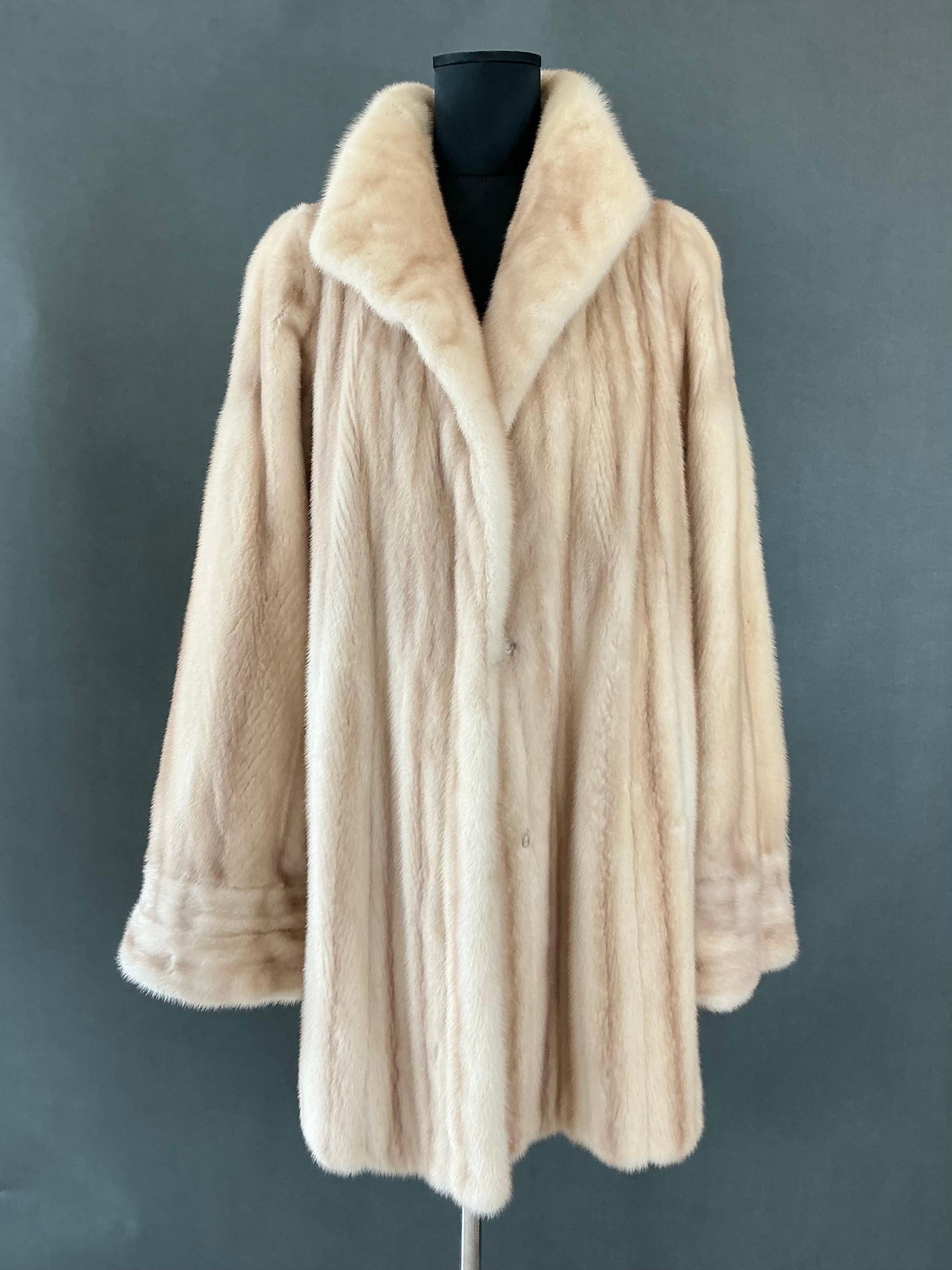 This Vintage Paolo Gucci Mink Coat is a luxurious and timeless piece that remains in vintage condition, offering an elegant, sophisticated addition to any wardrobe. While there are signs of age consistent with a vintage item, the fur is still plush
