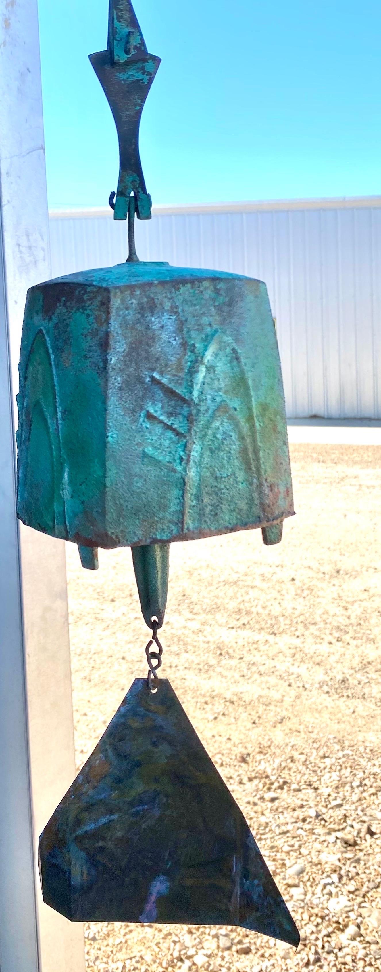 Vintage hanging sculpture windchime bell by Paolo Soleri features a beautiful patina, offers a deep rich sound, and is in great overall condition. 
Dimensions: 5.25