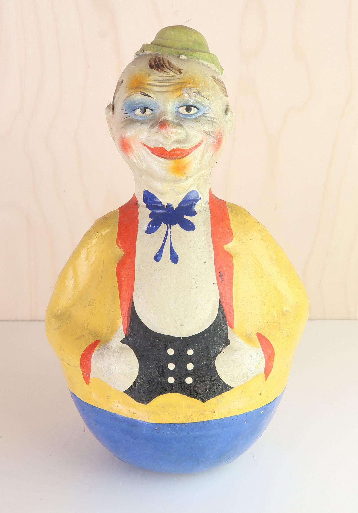 Lovely toy clown

A bell rings when it rocks

Hand painted papier mache.

Marked 