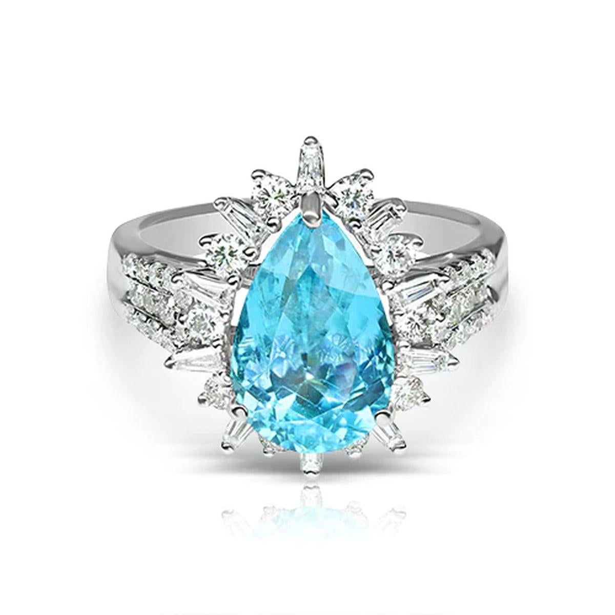 Simply Beautiful! Finely detailed GIA Pear shaped Paraiba Tourmaline and Diamond Vintage Gold Cocktail Ring. Centering a securely nestled Hand set 3.29 Carat Pear Neon Blue/Green Paraiba Tourmaline. Surrounded by Diamonds, E/F, VS, weighing approx.