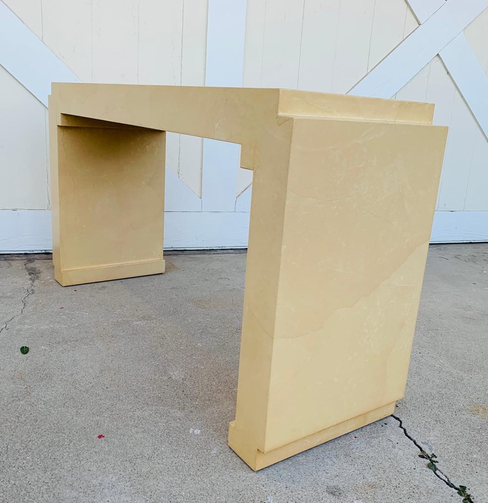 Stunningly beautiful console table in a geometric design and covered in parchment in the style of Karl Springer.

The table has beautiful architectural lines and is in very good vintage condition.

Partial label attached but the name of the