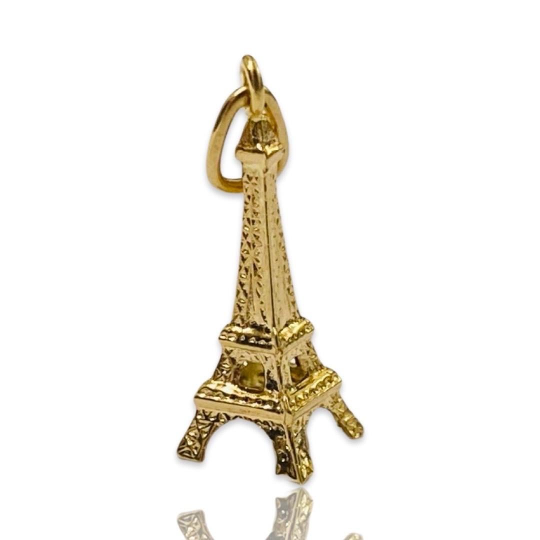 Vintage 18K yellow gold Paris France Eiffel Tower charm. Charm is has the French eagle gold hallmark and has been tested as solid 18K gold. Weighs 0.70 grams. 3/4” tall not including bail. In excellent condition. Circa 1960s
