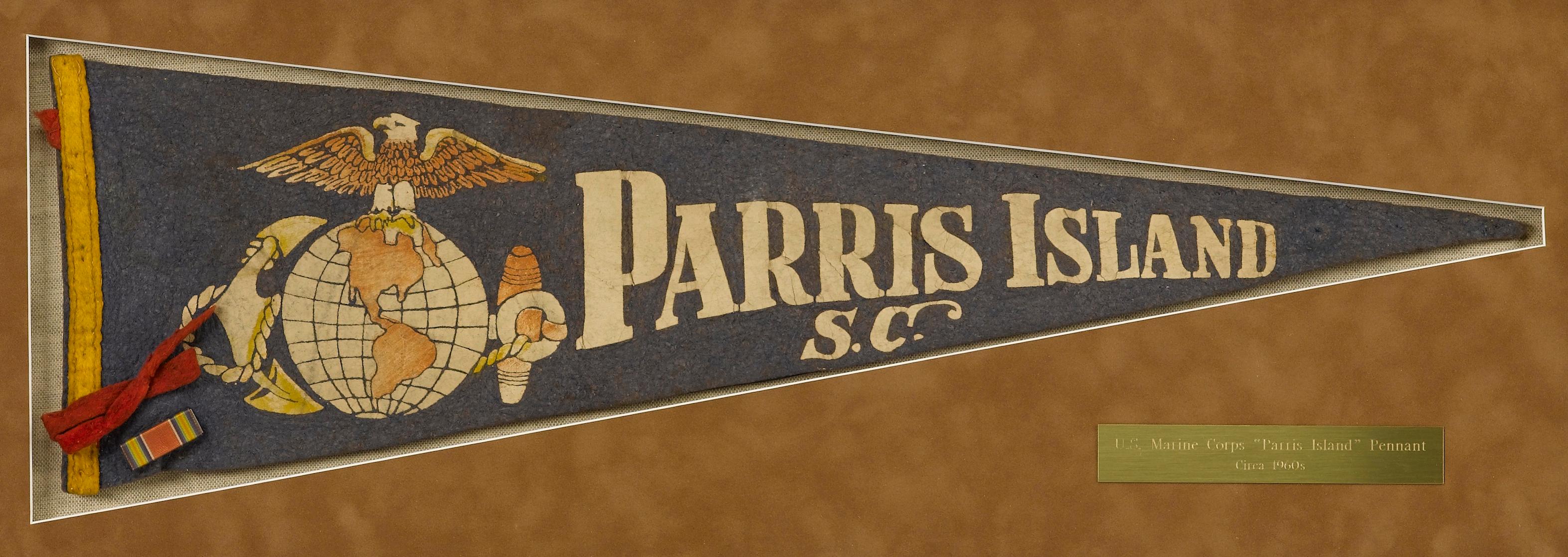 This is an original, vintage Parris Island, South Carolina pennant. The pennant is blue, with white script which reads 
