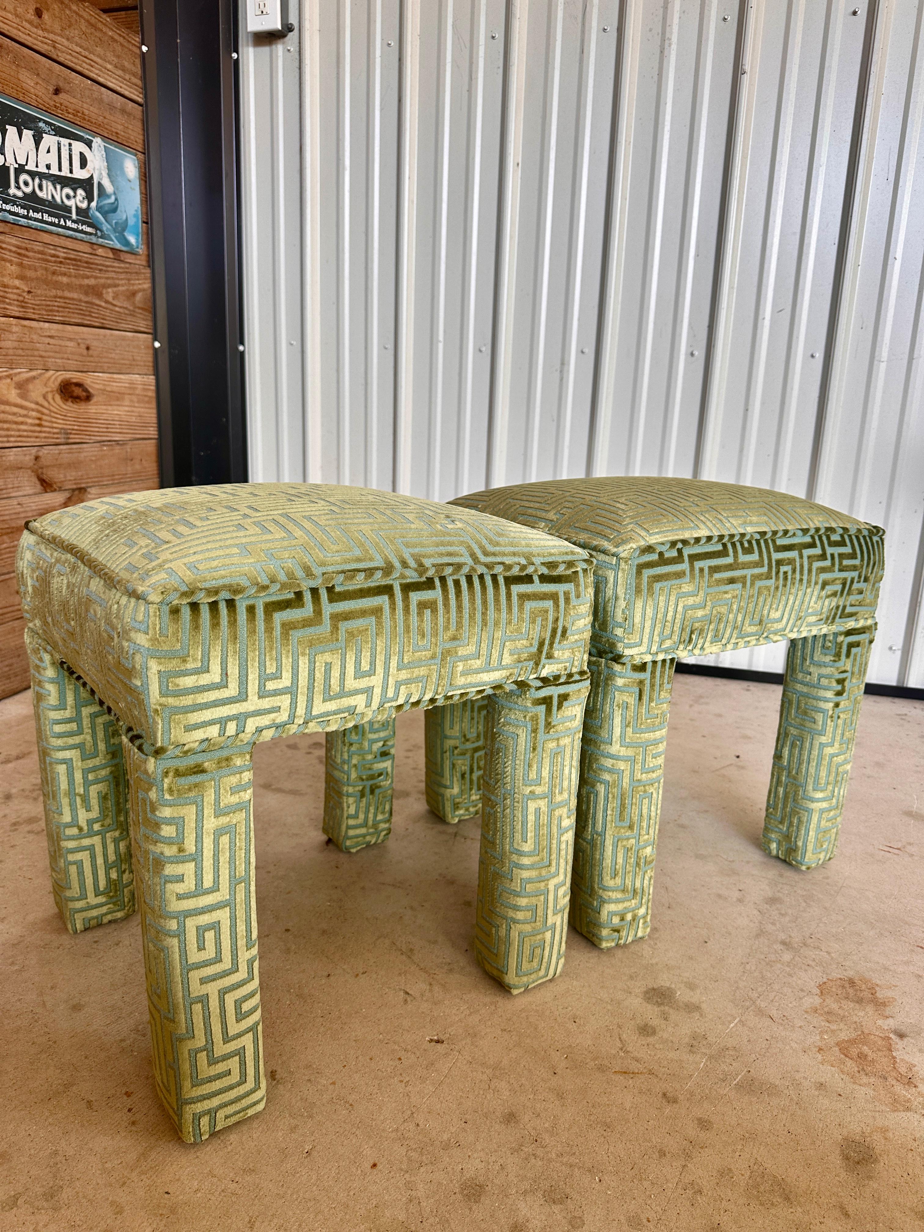 This stunning pair of vintage Parsons ottomans exudes sophistication with their custom upholstery in a vibrant Stroheim Romann geometric fabric.
The plush seats and fully upholstered legs create a seamless, modern aesthetic, while the bold pattern