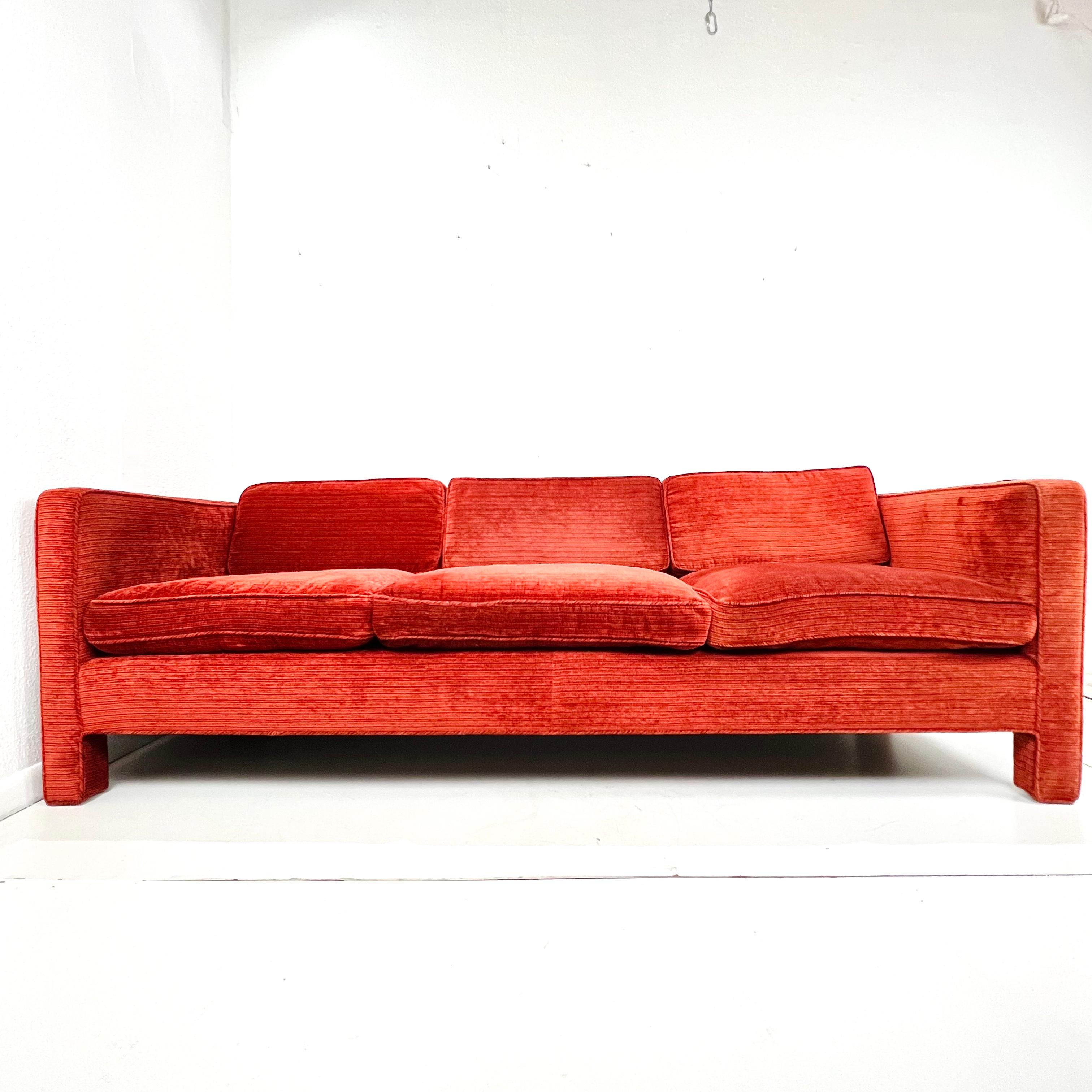 Vintage low profile Parsons style / tuxedo sofa in the manner of Milo Baughman. The sofa features a straight back, 3 seat cushions and 3 loose back cushions, and fully upholstered frame and feet. Sturdy and in good structural condition; Original