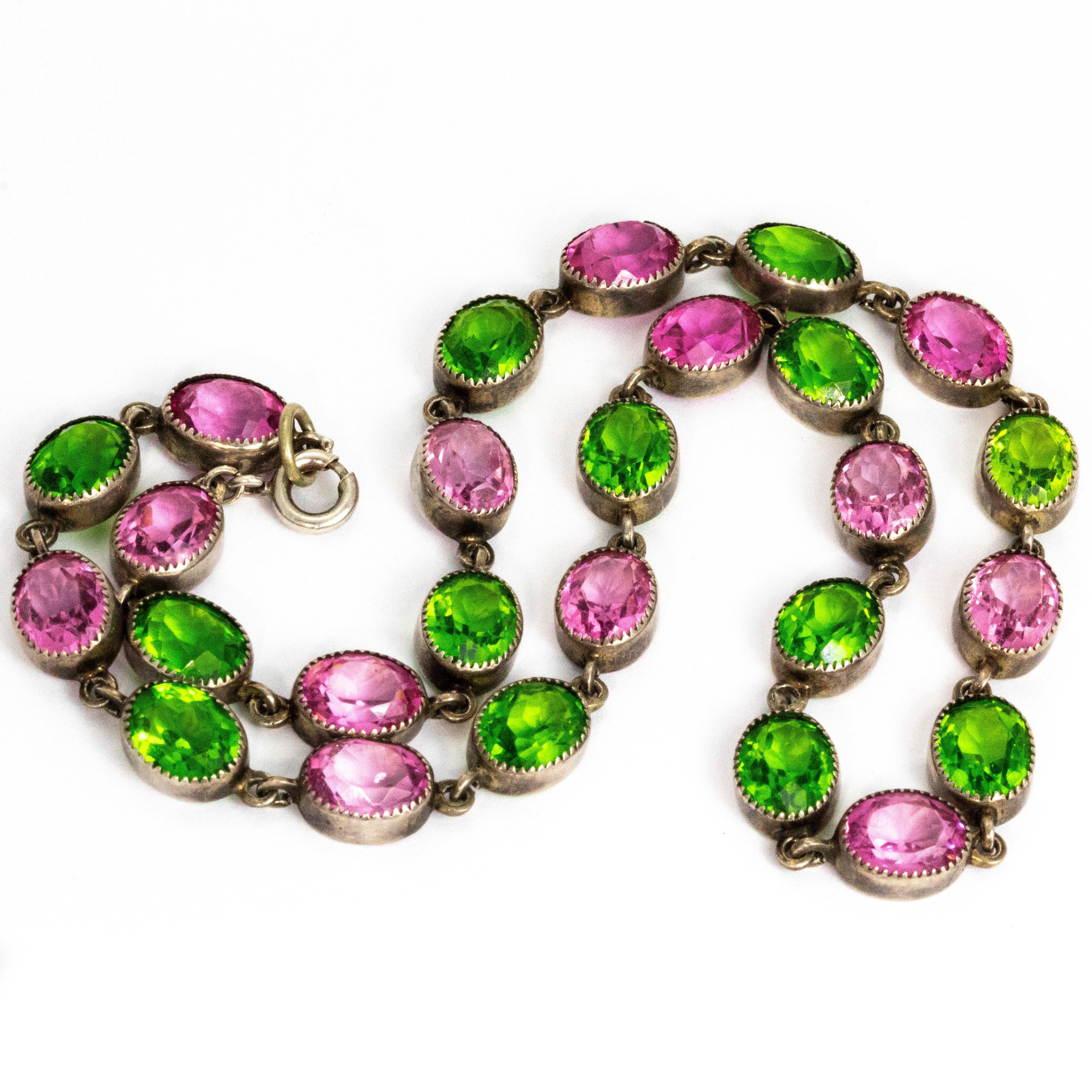 This riviera is absolutely stunning! The bright green and pink paste is a show stopping combination and are set in silver. Each paste is approximately 2.5carat each and oval in shape. The length of the necklace is lovely and would sit wonderfully on