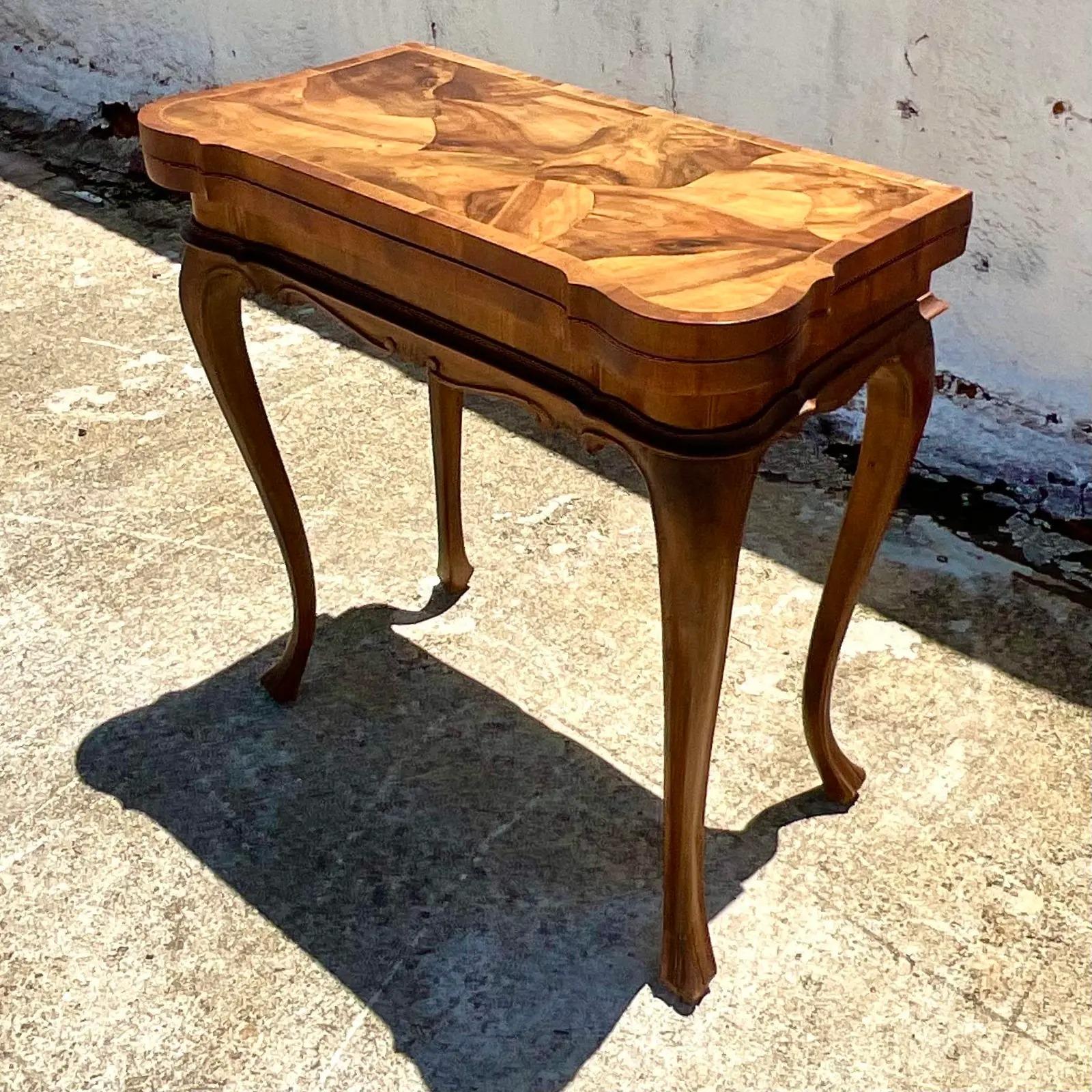A fantastic vintage patchwork Burl wood card table. A chic flip top design that opens up and turns to reveal a stunning table top. Perfect for last minute seating for large parties or a charming card game. Even a puzzle table! So many uses. You can