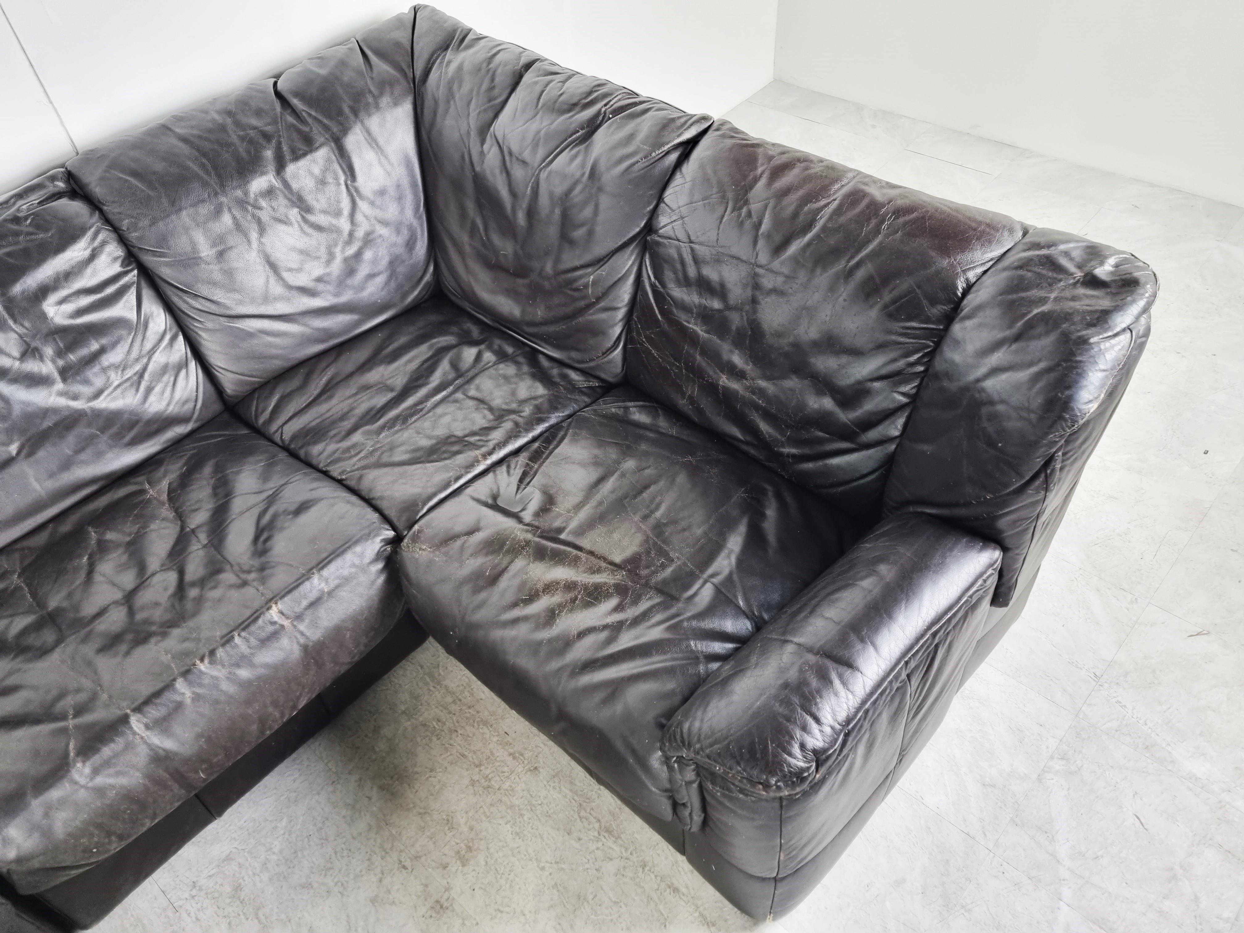 Mid century sectional/modular sofa set in beautifully patchwork very dark brown leather.

The sofa set is completely modular and consists of 7 elements.

Ideal piece to create a free standing sofa space which will be the center piece of your