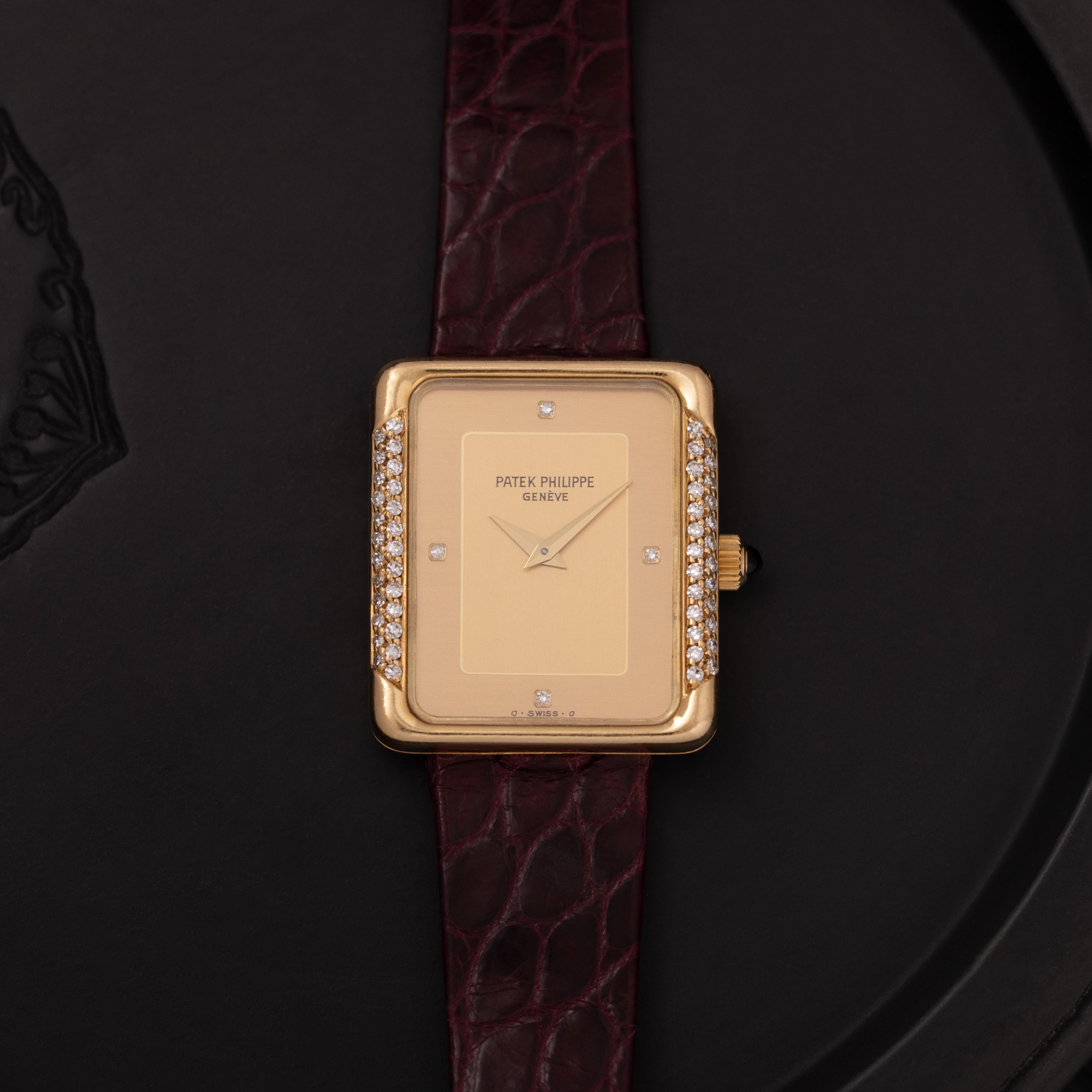 Maker: Patek Philippe
Year: 1980s
Material: 18K Yellow Gold and Diamond Bezel
Dial: Champagne Gold
Case Measurement:  23mm x 27mm
Movement:  Manual Wind
Condition: Very Good - some wear on the original Patek strap
Weight: 36 Grams
Size: fits up to a