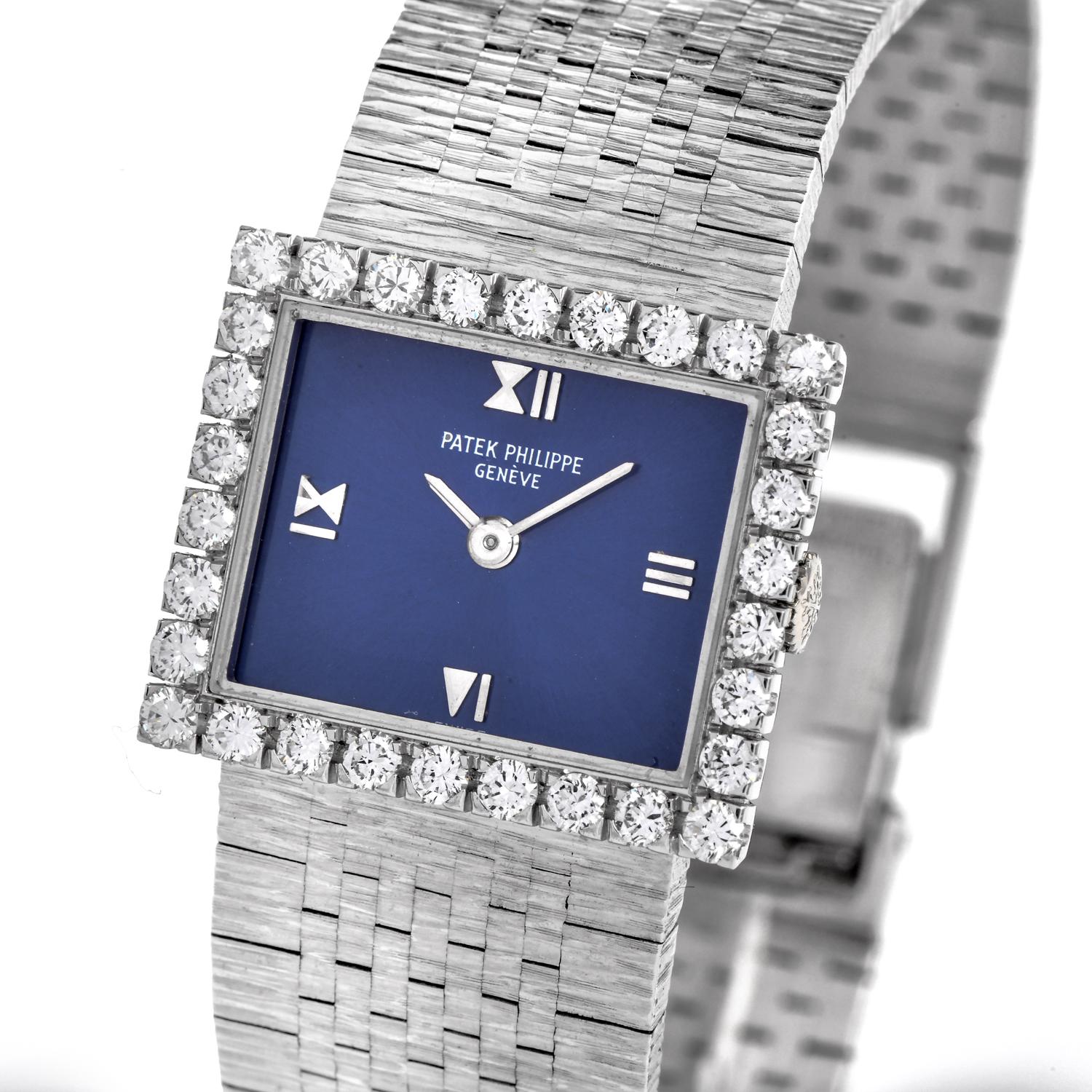 This elegant Vintage 1960s all-original Patek Philippe ladies' watch is crafted in 18k white gold. The rectangular case with original mechanical movement presents an attractive royal blue dial embraced by 30 Factory set round brilliant cut diamonds
