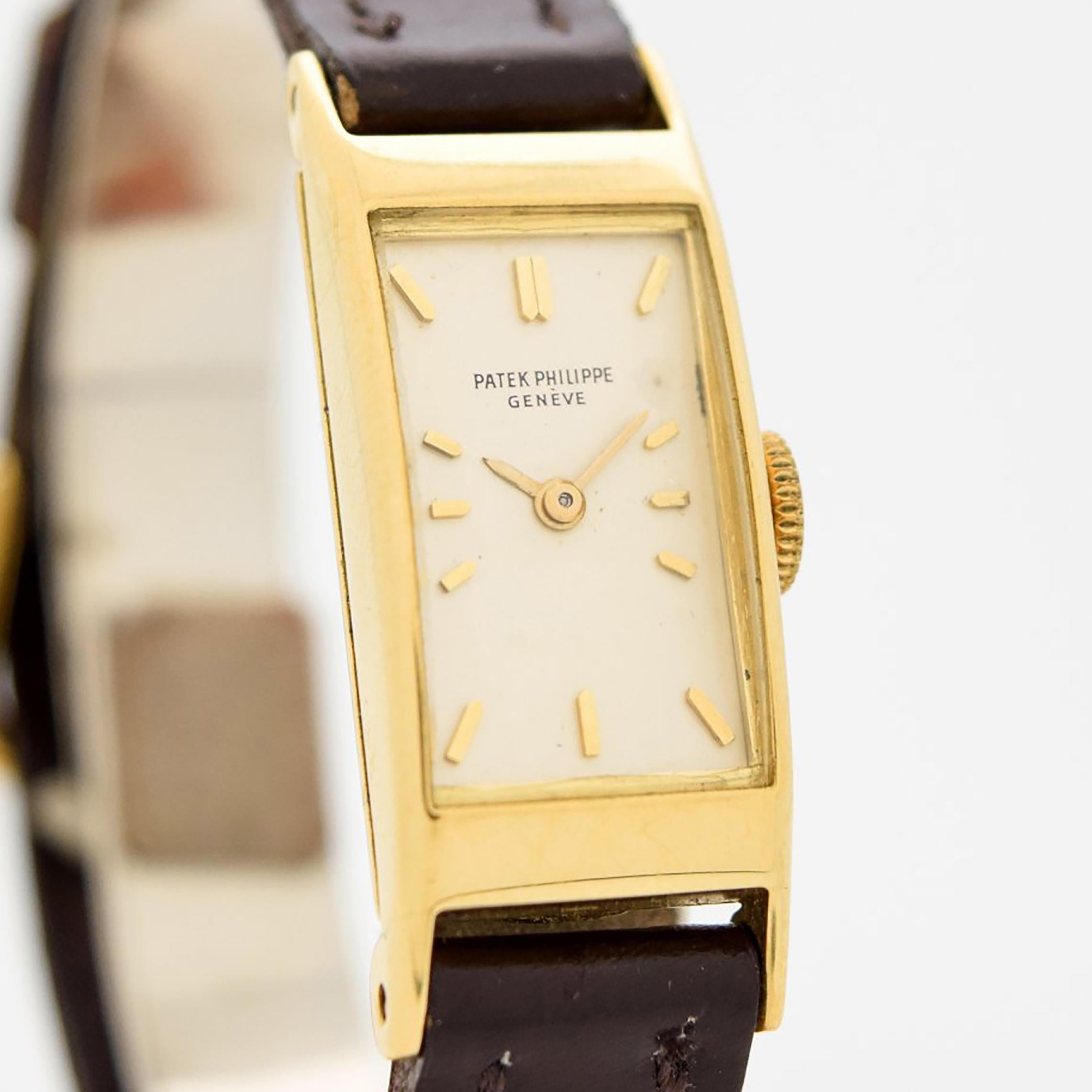 1943 Vintage Patek Philippe Ladies Ref. 2292 18k Yellow Gold watch with Silver Dial with Applied Yellow Gold Bar Markers. 13mm x 33mm lug to lug (0.51 in. x 1.3 in.) - Equipped with an 18-jewel, manual caliber movement. Featured on a Genuine Calf