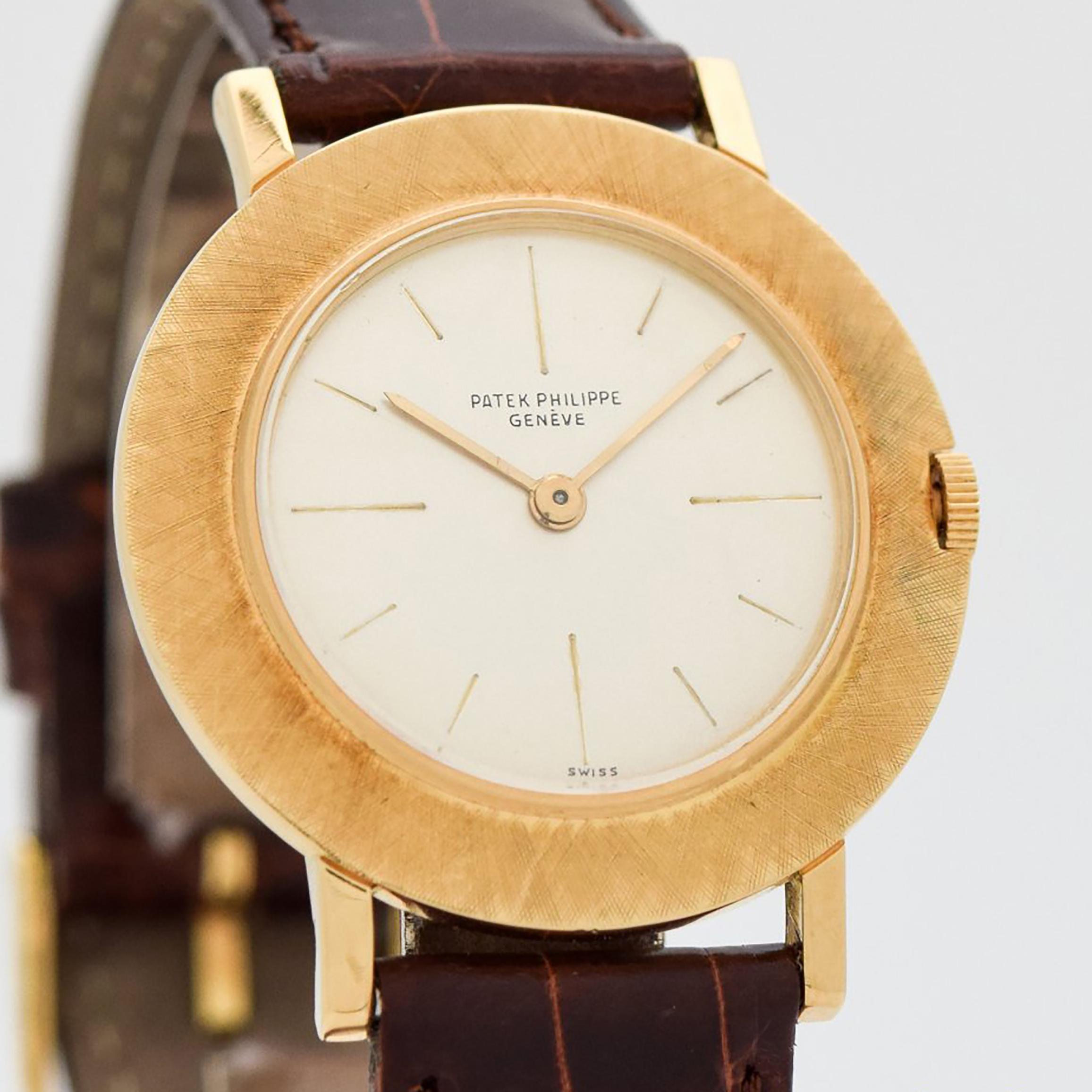 1958 Vintage Patek Philippe Ref. 2594 18k Yellow Gold watch with Silver Dial with Recessed Stick Markers with Patek Philippe Extract From The Archives Document. 32mm x 37mm lug to lug (1.26 in. x 1.46 in.) - 18 jewel, manual caliber movement. Triple