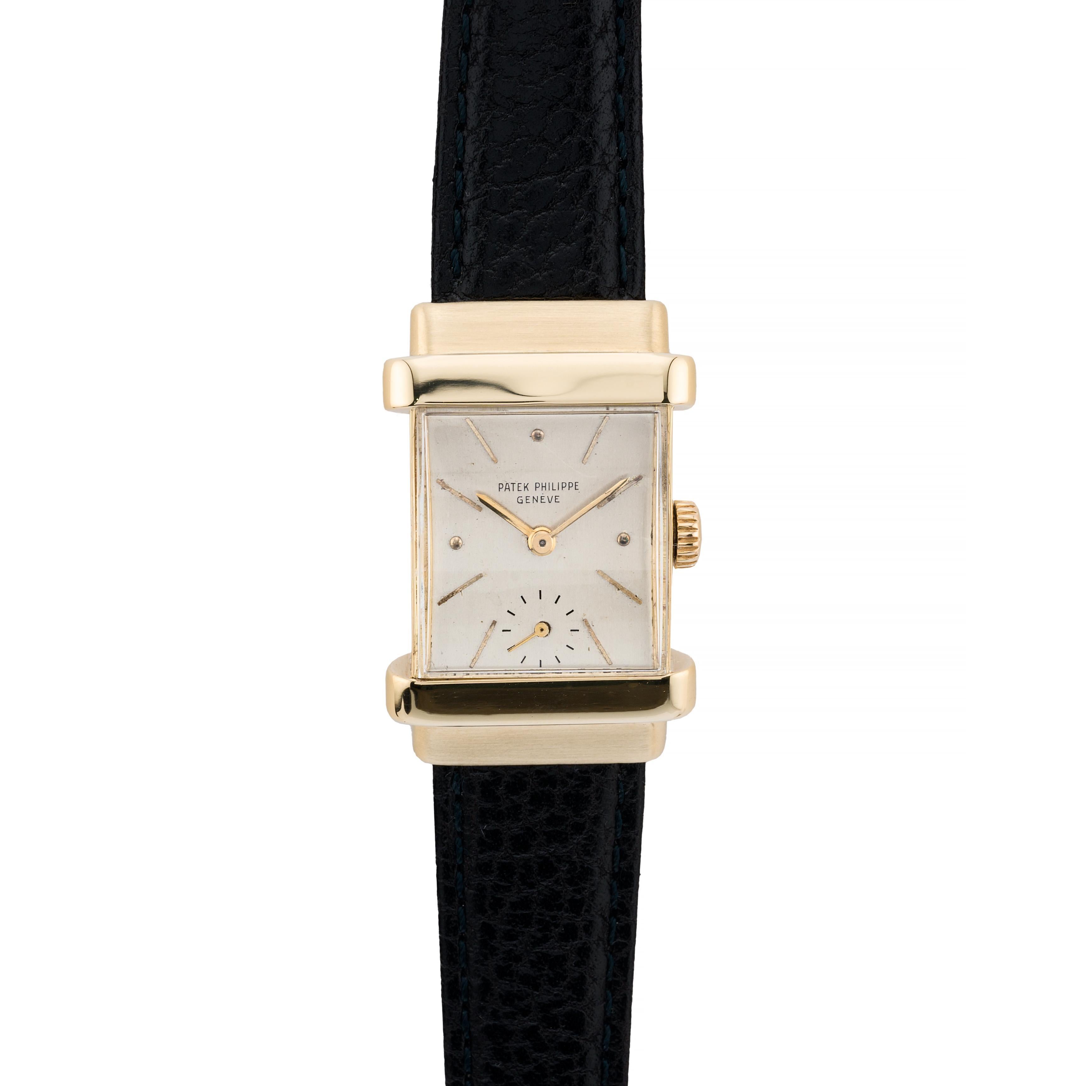 Aston Estate Jewelry Presents:

A Patek Philippe 'Top Hat' timepiece, crafted in 18 karat gold circa 1955. This rectangular watch features it's original silver face, showcasing a minimalist design with subtle baton markers. The watch is encased in