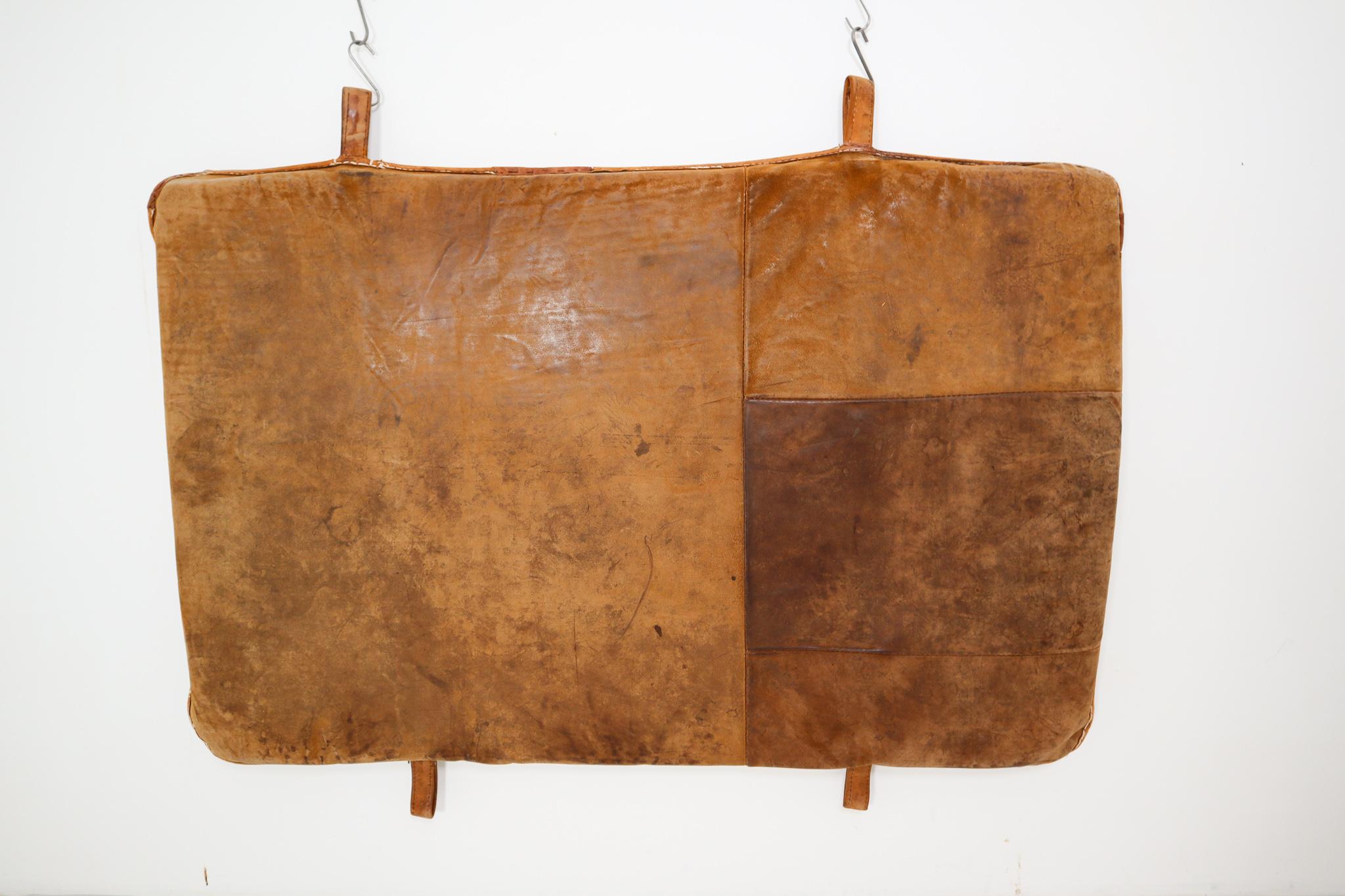 This brown leather gym mat originally used in the gym, now ideal in the home as a bedhead, or a playmat. The gym mat is in a very good vintage condition with original patina. And is made in Czech Republic, 1950s.