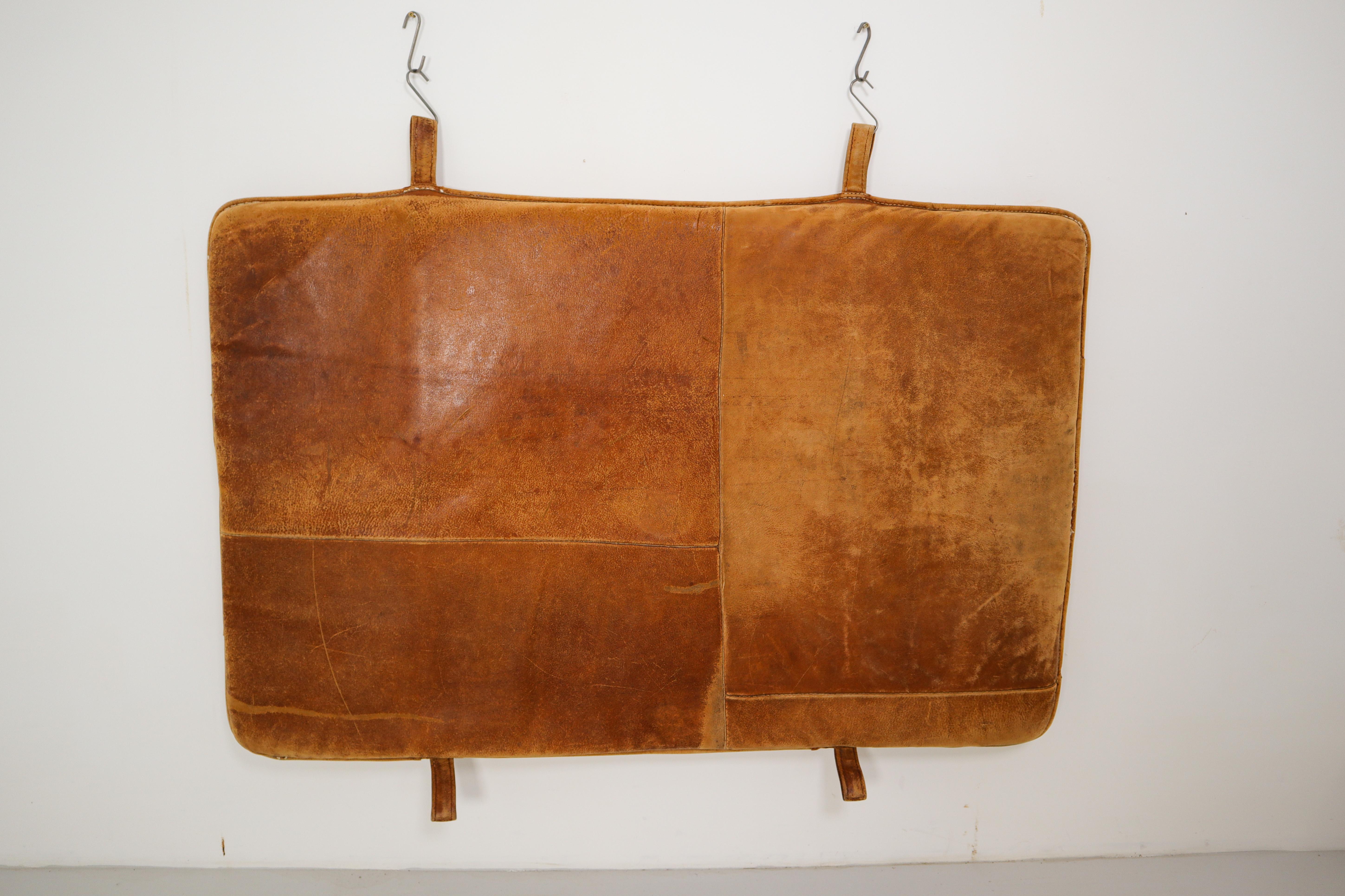 This cognac brown leather gym mat originally used in the gym, now ideal in the home as a bedhead, or a playmat. The gym mat is in a very good vintage condition with original patina. And is made in Czech Republic, 1940s.