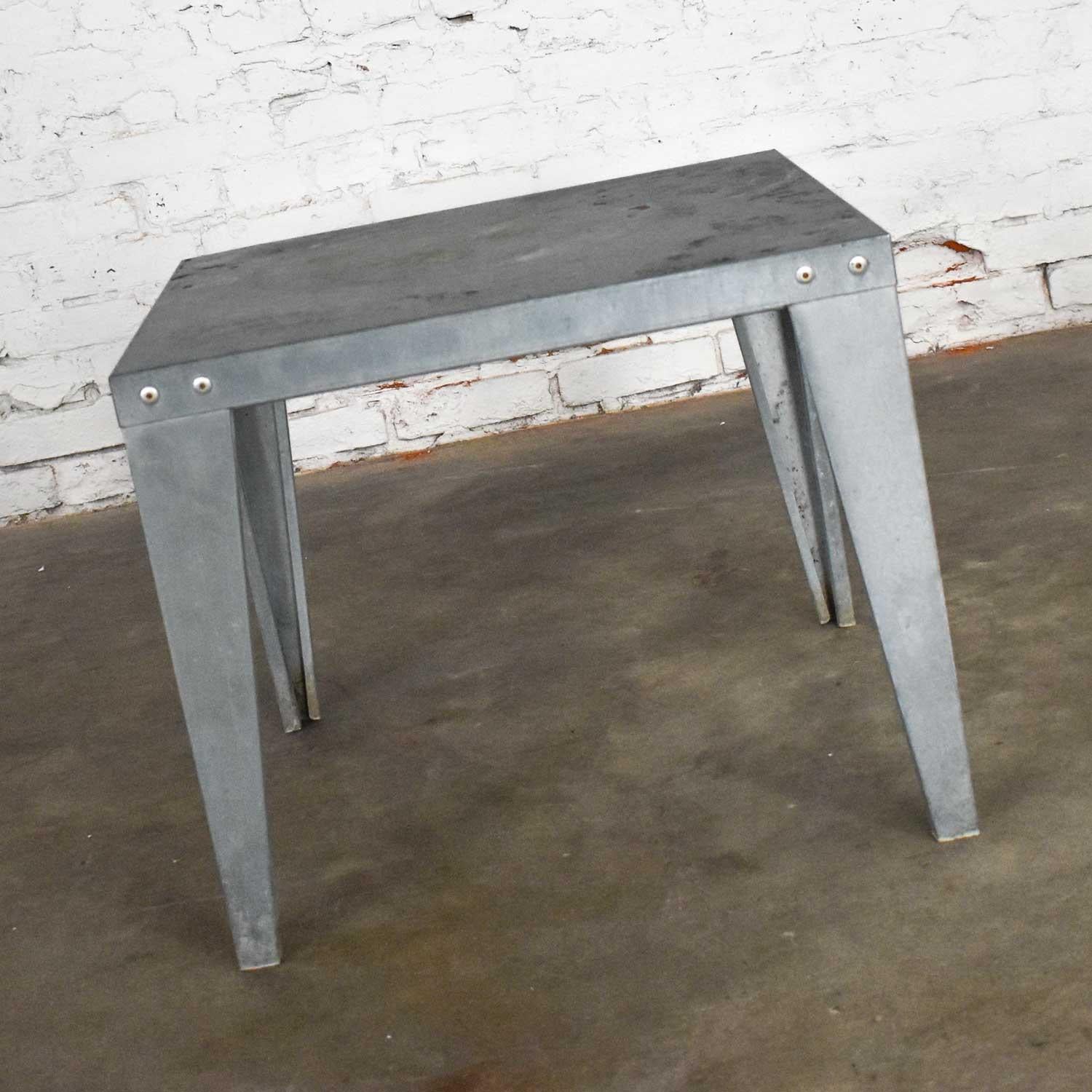 Fabulous, galvanized metal side table or end table with an interesting naturally aged patinated finish. In wonderful vintage condition with age-appropriate wear and a lot of gorgeous patina. Please see photos. Circa Late 20th Century.

  

When