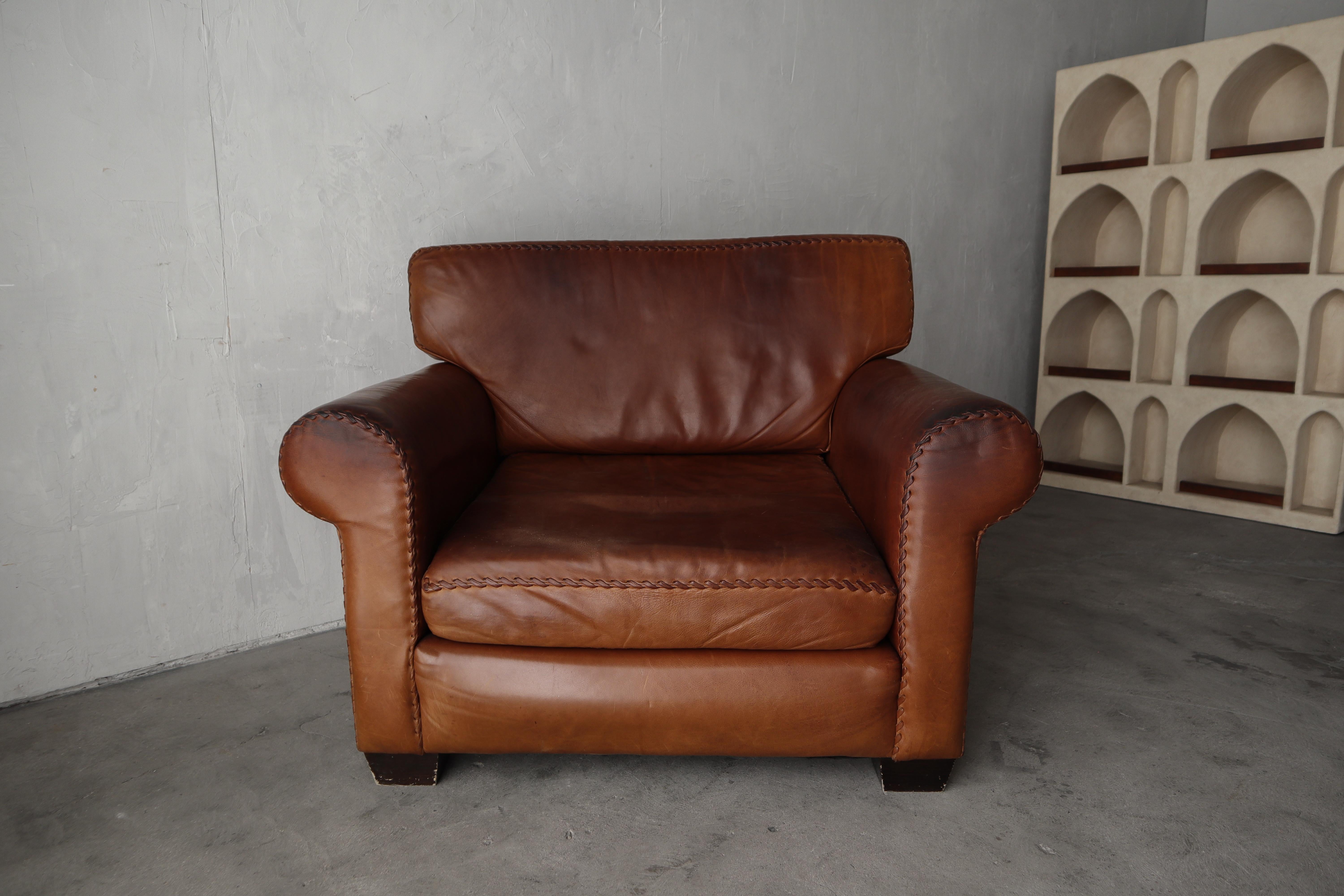 When the patina and small details makes the piece. This incredible patinated leather chair and ottoman are ready for their next life. I love the look and feel of the butter soft patinated leather, and the chunky baseball style stitching