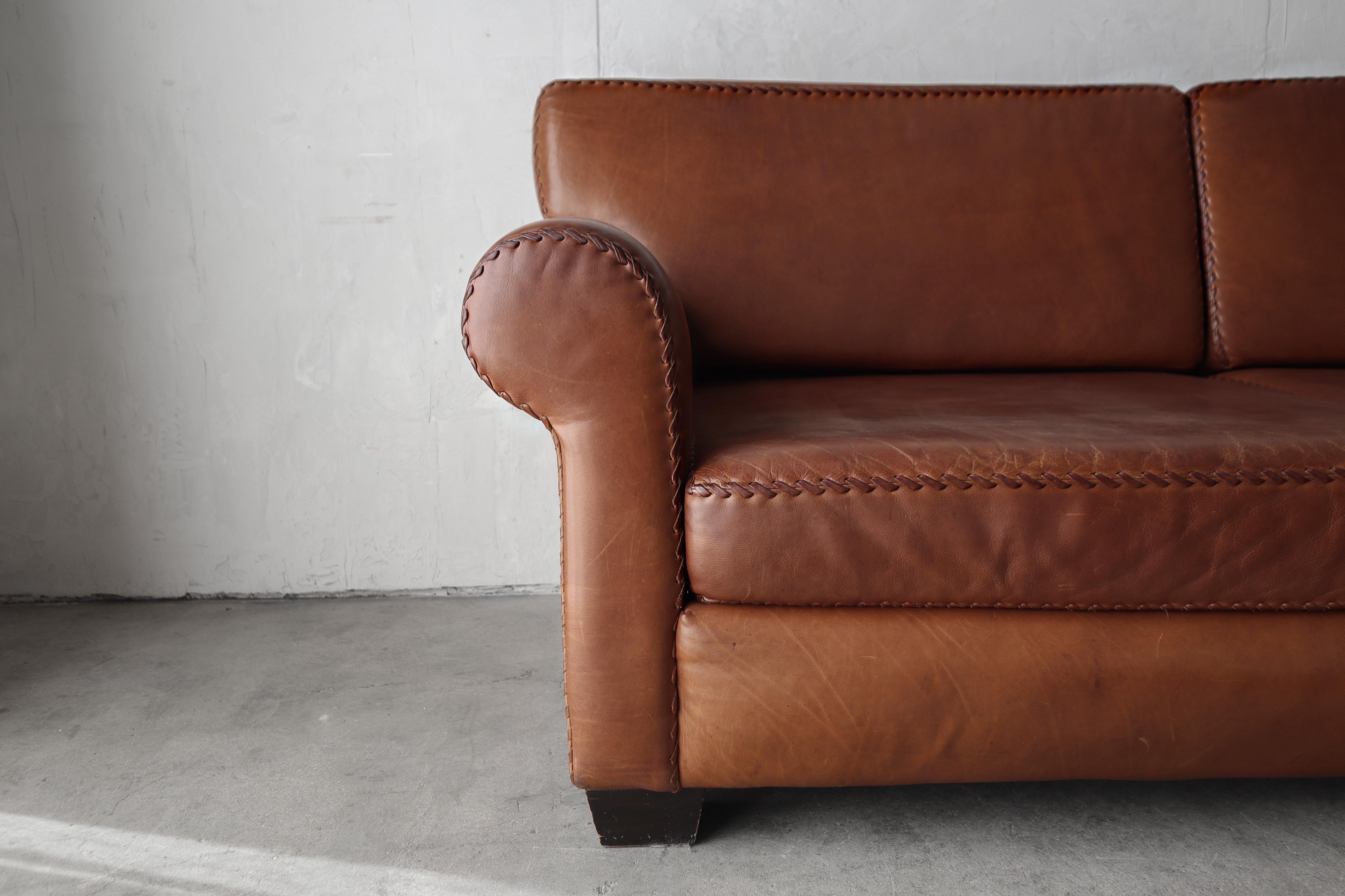 Vintage Patinated Leather Baseball Stich Sofa In Good Condition For Sale In Las Vegas, NV