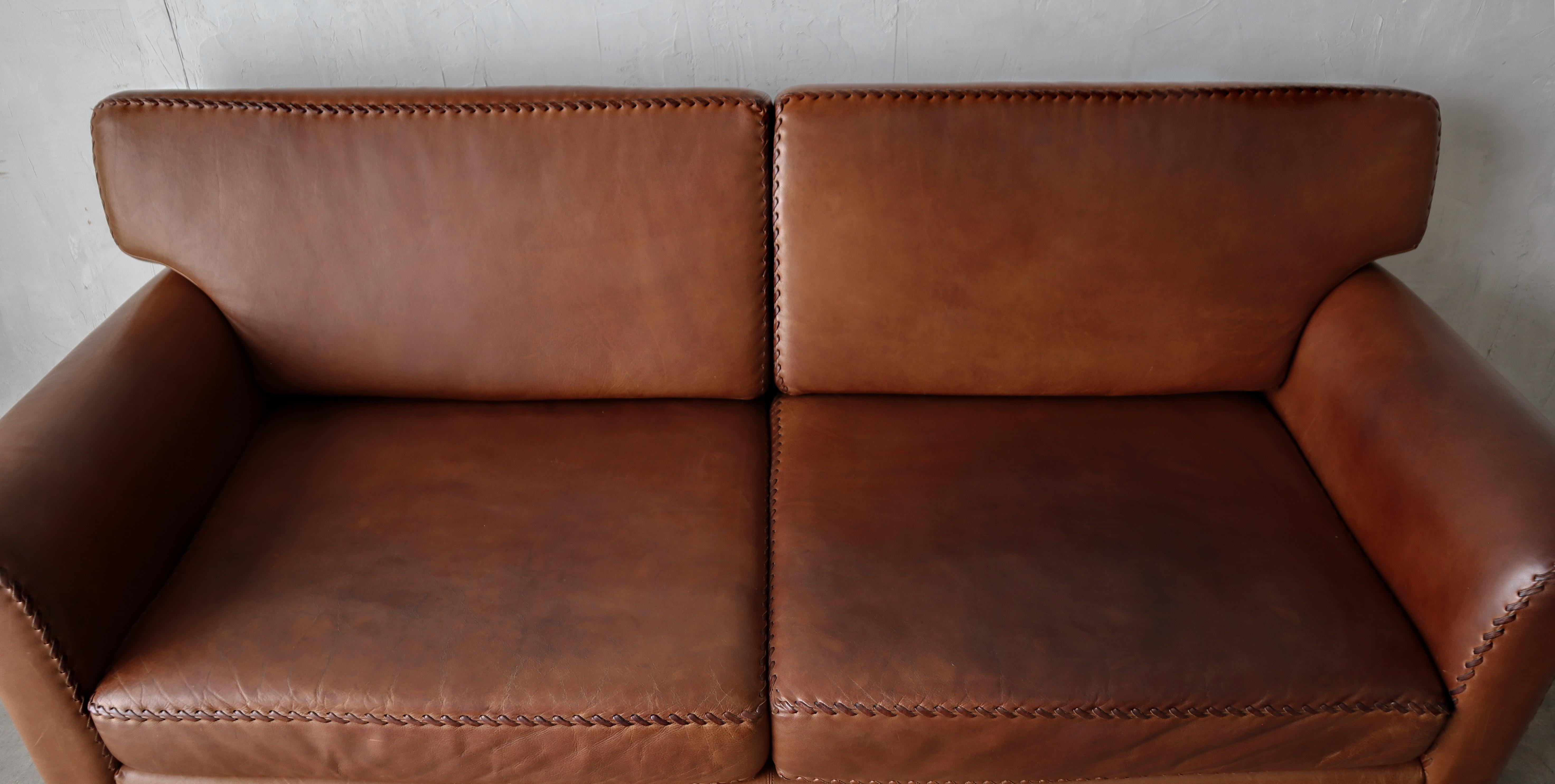 20th Century Vintage Patinated Leather Baseball Stich Sofa For Sale