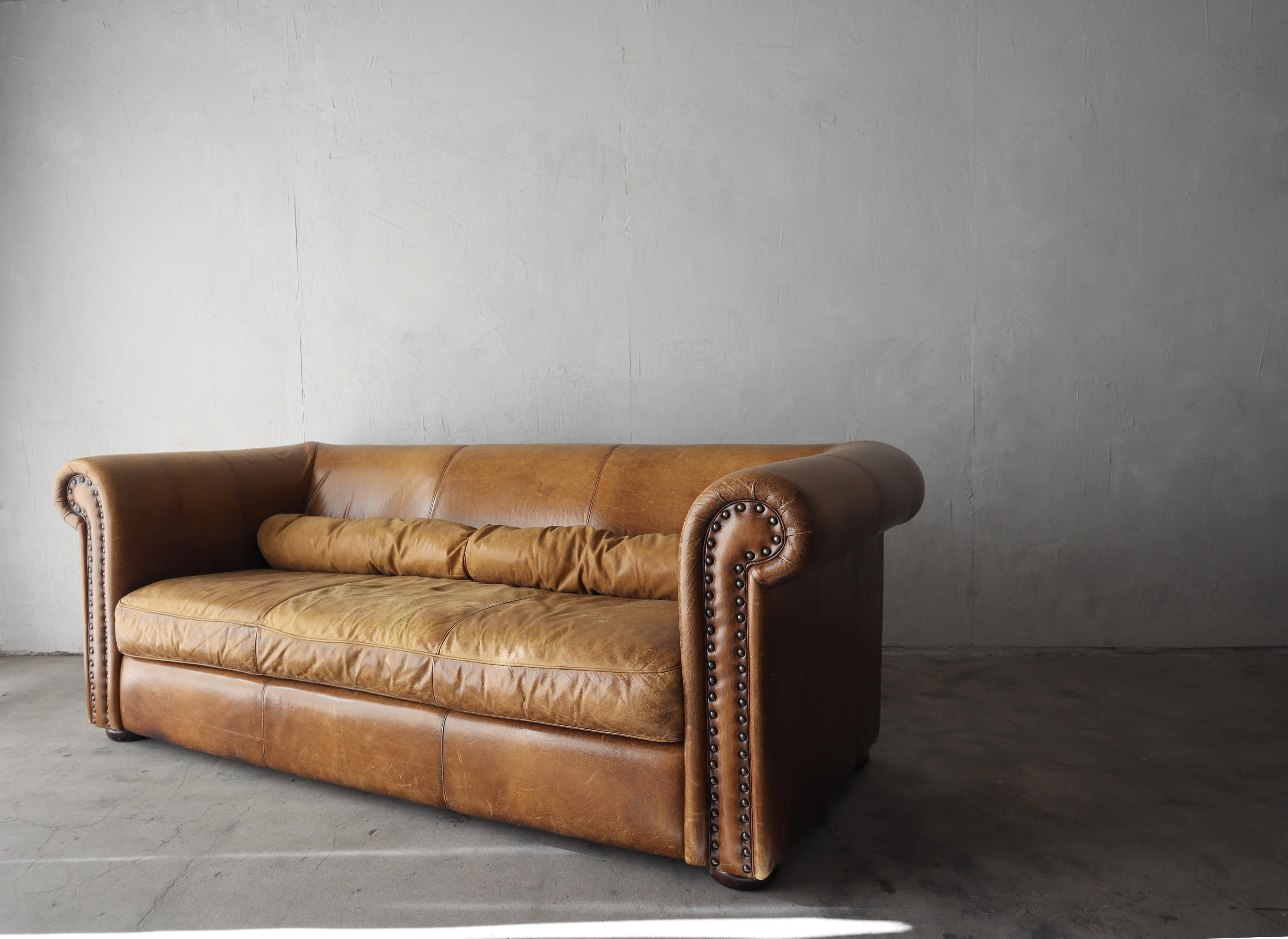 When the patina makes the piece. This incredible patinated leather sofa is ready for its next life. I envision this beauty as a store fixture or as the center of attention in a well appointed eclectic space. 

The sofa is structurally sound and