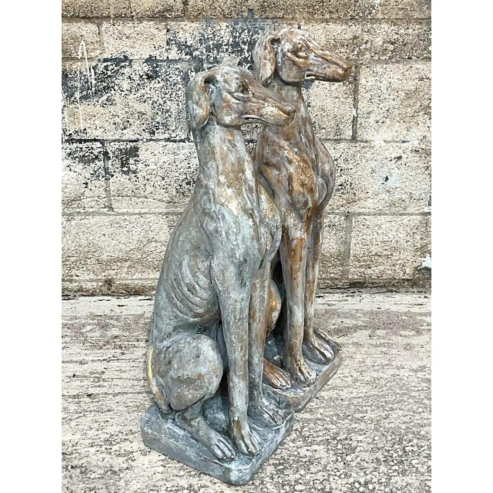 Fabulous pair of vintage greyhound dogs. Beautiful hand mottled finish makes them perfect indoors or out. A really regal pose. Acquired from a Palm Beach estate.