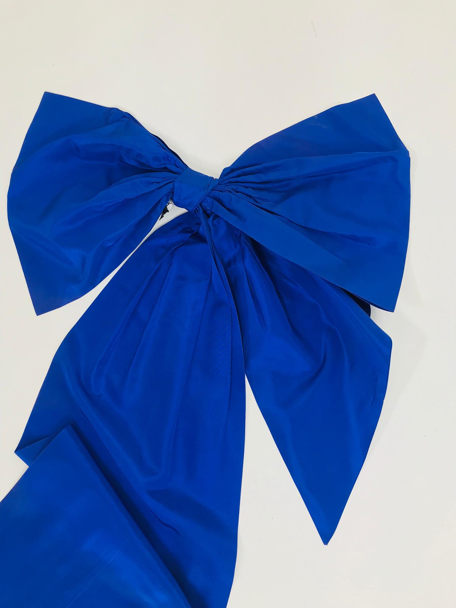 Vintage Patrick Kelly, Paris big blue taffeta bow from the 1980s. This amusing  piece will be a perfect addition to a dress, skirt, cape, coat or a hair accessory for anyone with as much imagination and whimsy as it's creator!  
A bow that is