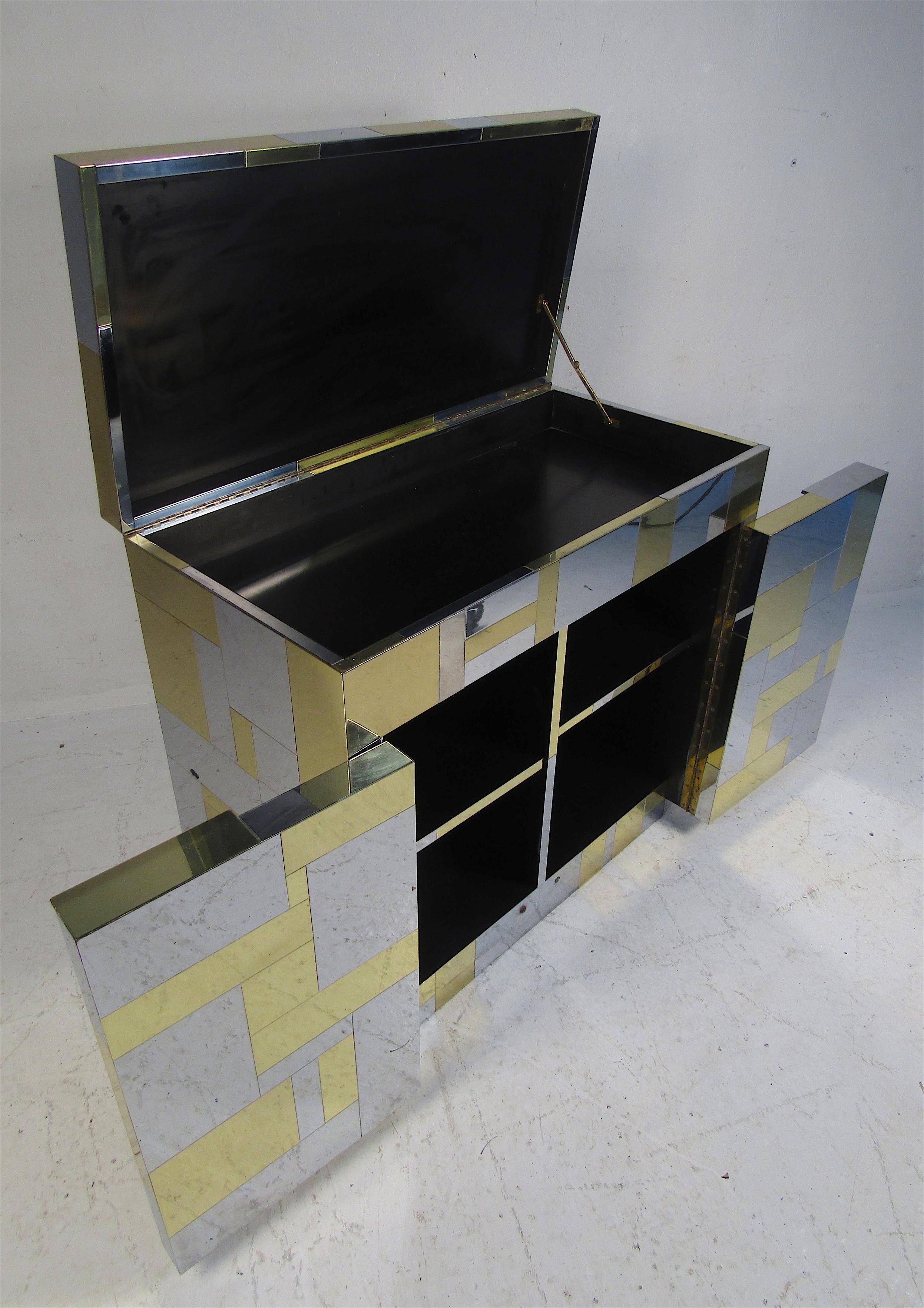 Beautiful signed Mid-Century Modern bar cabinet by Paul Evans for Directional. A wonderful patchwork design with a flip top and two cabinet doors below. Sleek case piece that looks great in any home, business, or office. Pe 200 series. Please