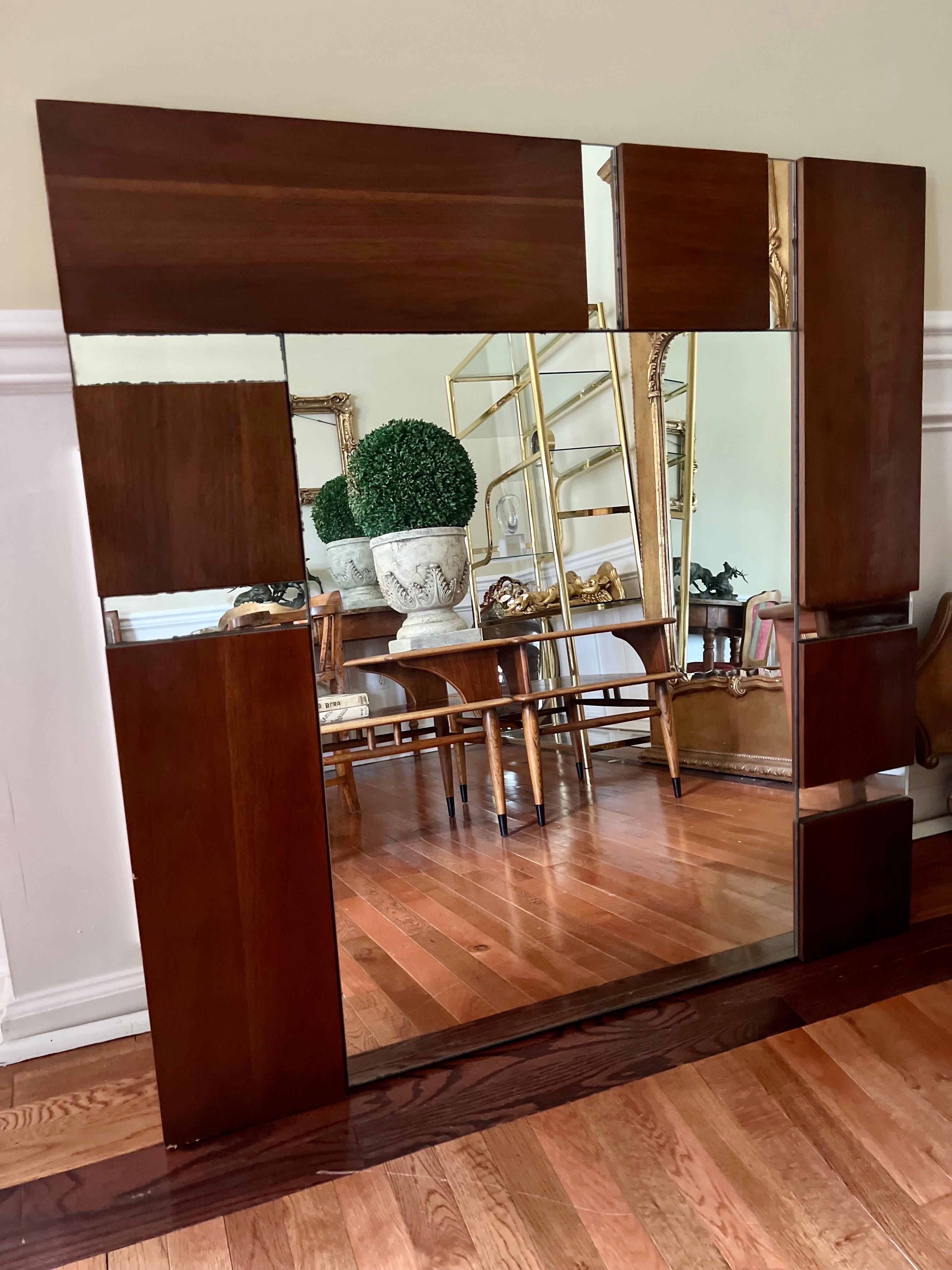 Vintage modern brutalist walnut block panel mirror in the manner of Paul Evans. Bold geometric pattern and rich, deep wood grain create a dramatic elegance for this fabulous piece.