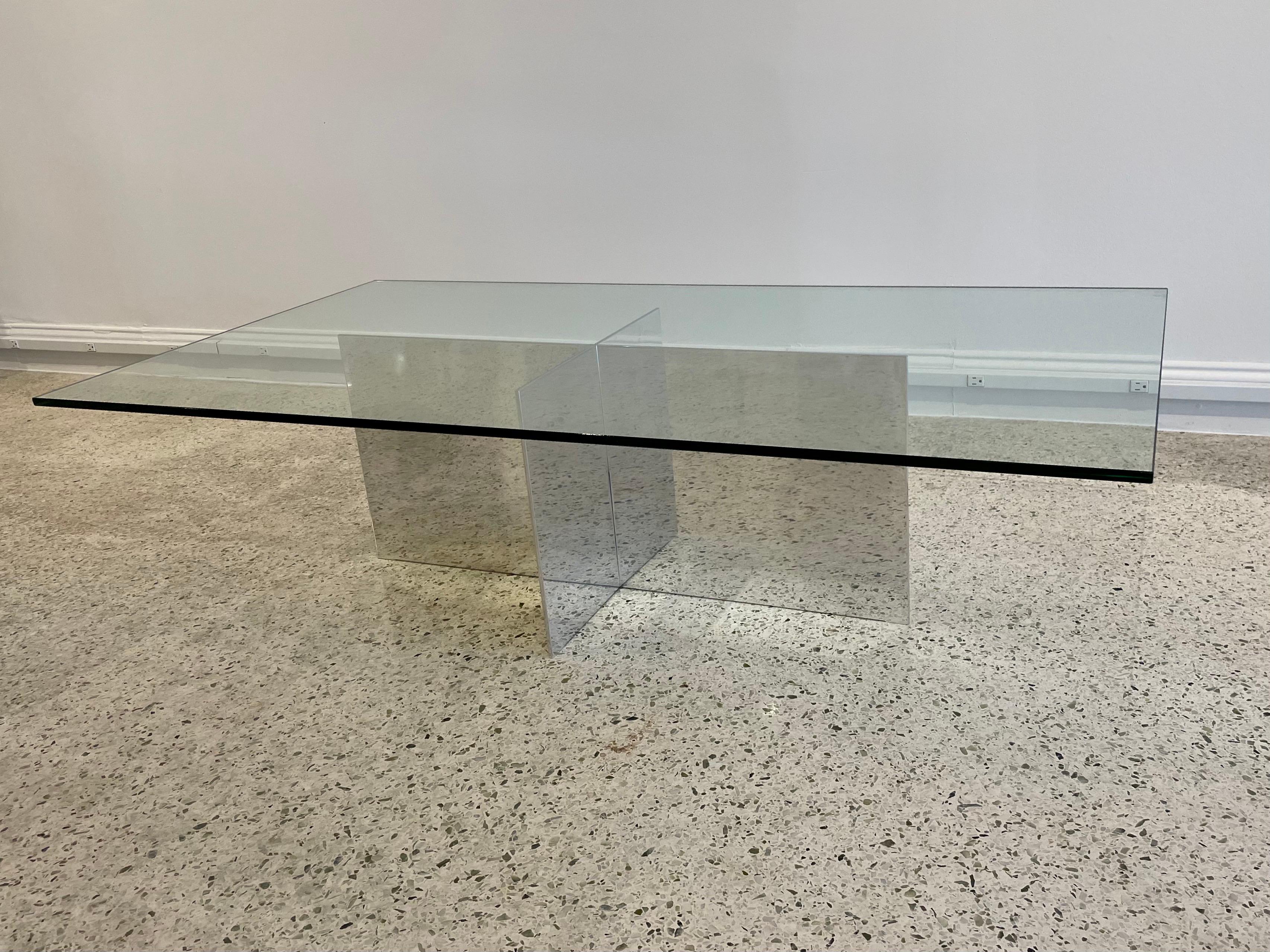 This rectangular cocktail table was designed and created by Paul Mayen for Habitat in the 1970s. It is fabricated out of polished aluminum and has a NEW glass top.

Paul Mayen was a founder of Habitat, Intrex and Architectural Supplements, Inc. He