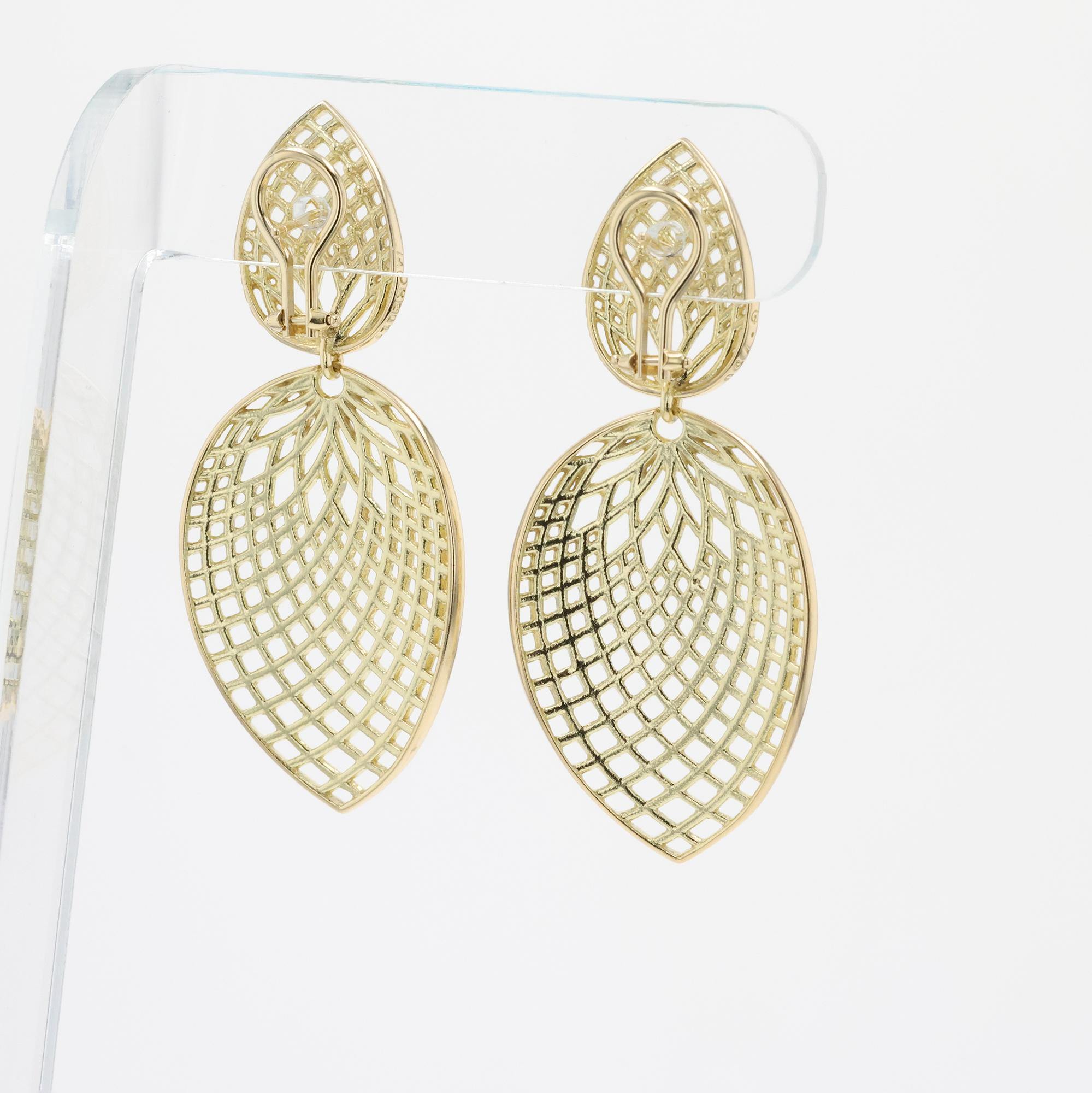 Vintage 18Yellow Gold Paul Morelli large gold spiral leaf earrings with leaf drop
and openwork spiral design with posts for pierced ears with Omega clip back for
balance and support. 