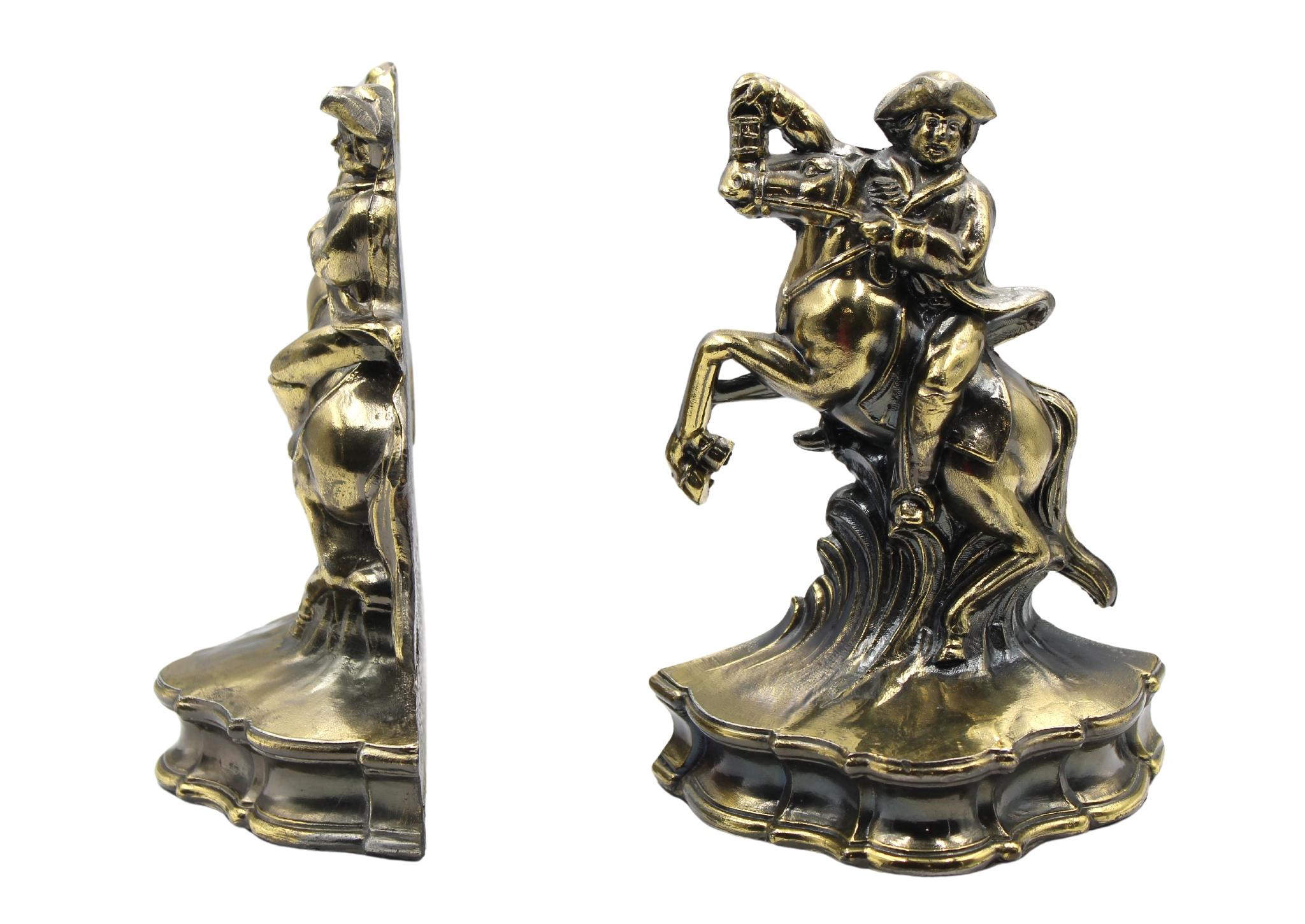 Presented is a pair of brass bookends, depicting Paul Revere and his revolutionary midnight ride. The bookends show Revere, mounted on horseback, with a tricorner hat and one hand outstretched, holding a lantern. Paul Revere is one of the most