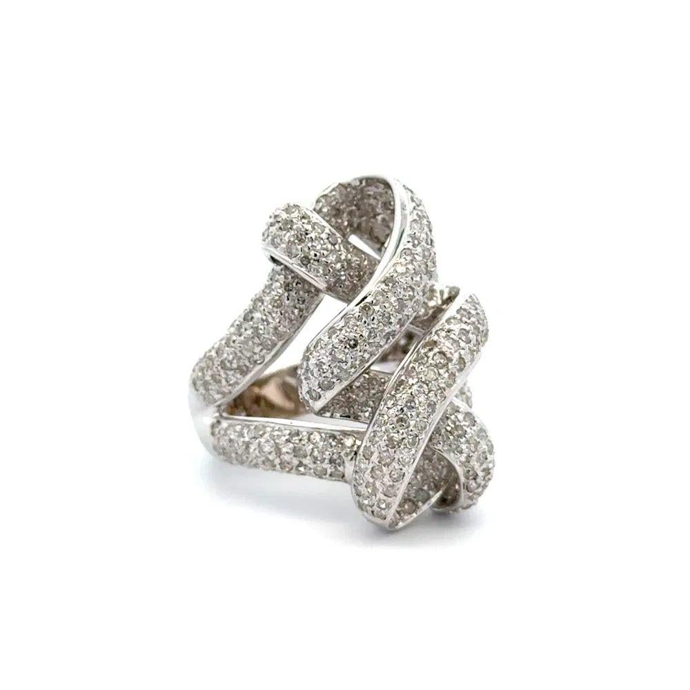 Simply Beautiful! Pave Diamond Flowing Ribbon Gold Ring. Hand set with Diamonds, weighing approx. 2.50tcw. Hand crafted18K White Gold mounting. Ring size 6, we offer ring resizing. The ring epitomizes vintage charm, ideal worn alone or as a lovely