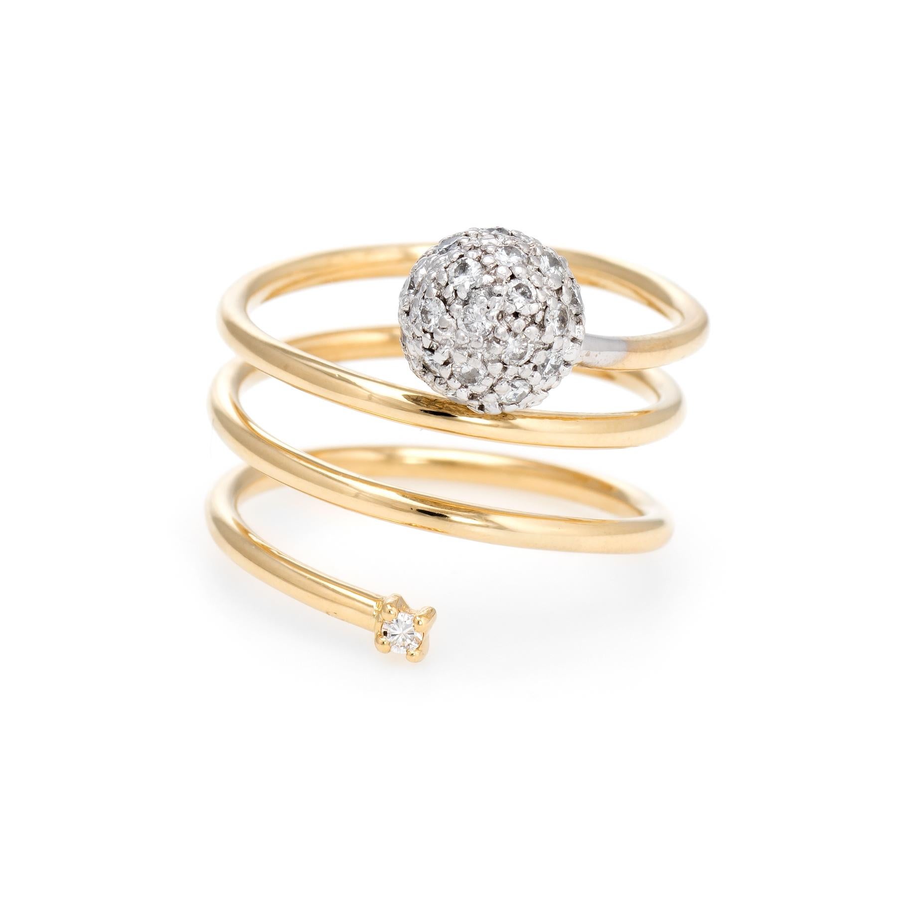 Distinct & stylish pave diamond orb ring, crafted in 18 karat yellow gold. 

Full cut diamonds are pave set into the orb and total an estimated 0.25 carats (estimated at I color and SI1 clarity). 

The coiled band with diamond orb offers a stylish