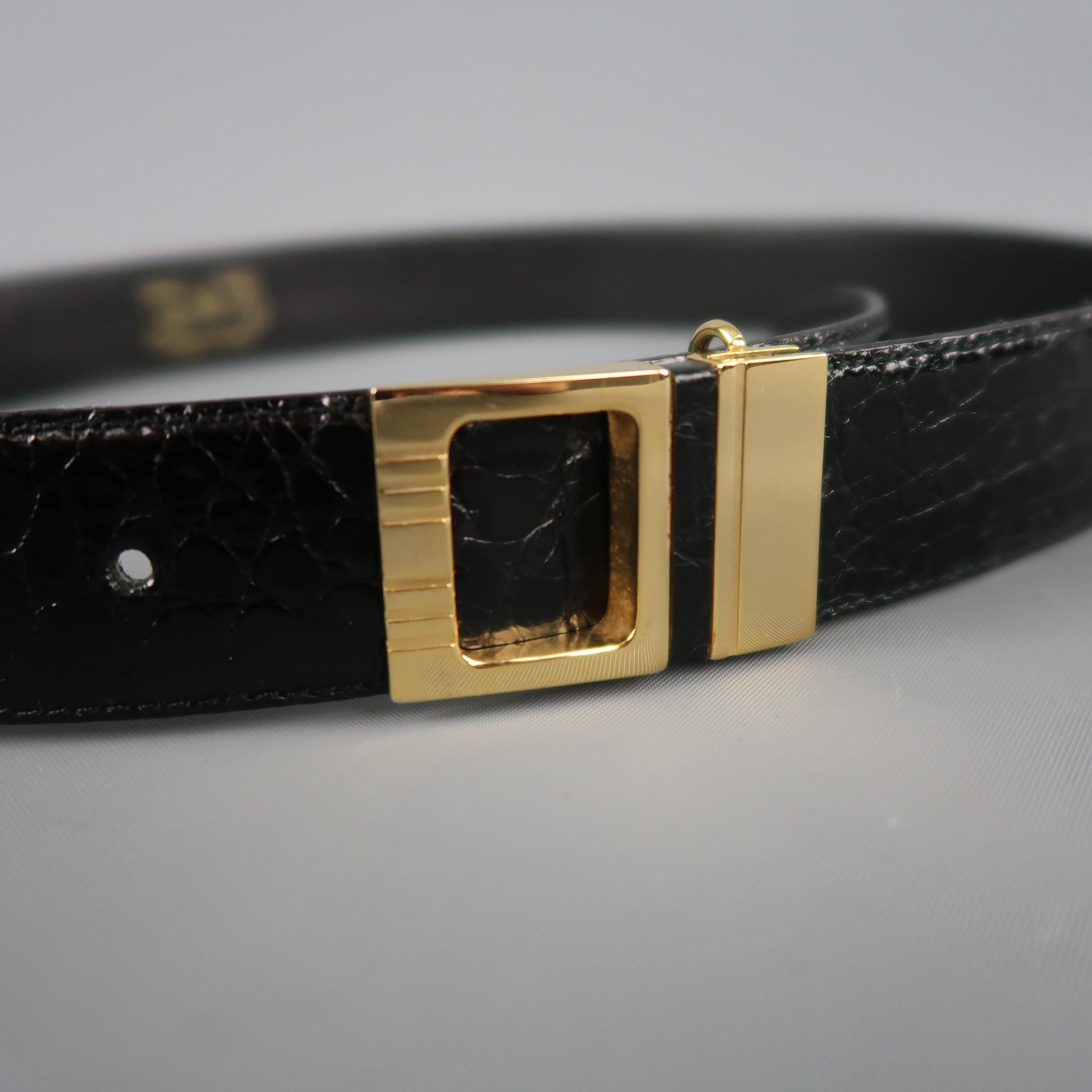 Vintage P&B dress belt features a black alligator textured patent leather strap with a gold tone cutout buckle. Made in Italy.
 
Excellent Pre-Owned Condition.
Marked: 75/30
 
Length: 36.25 in.
Width: 1 in.
Fits: 28.5-32.5 in.