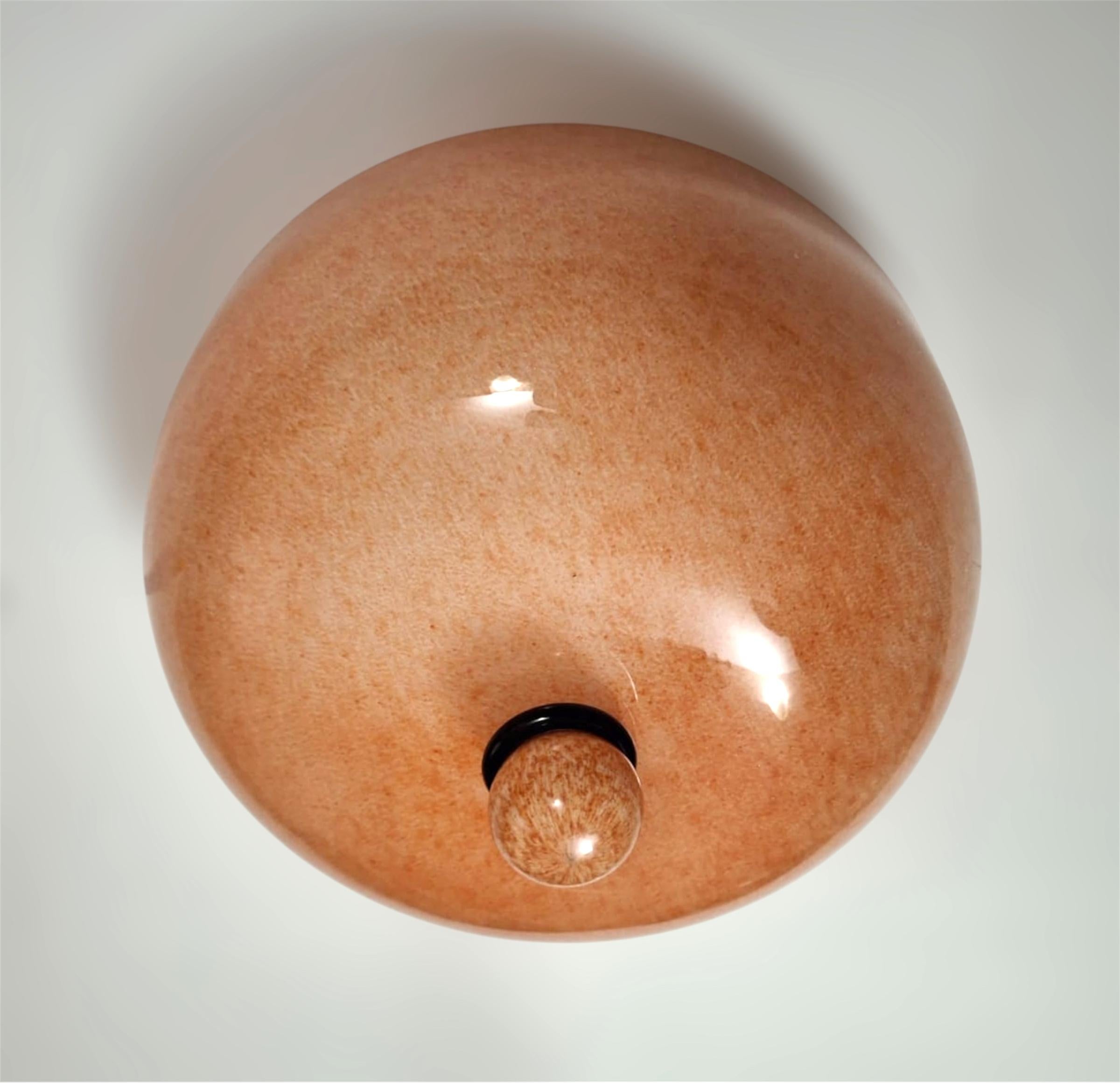 Vintage Italian flush mount with peach colored Murano glass shade / Made in Italy attributed to Venini, circa 1960s 
Measures: diameter 12 inches, height 7 inches
3 lights / E12 or E14 type / max 40W each
1 available in stock in Italy
Order